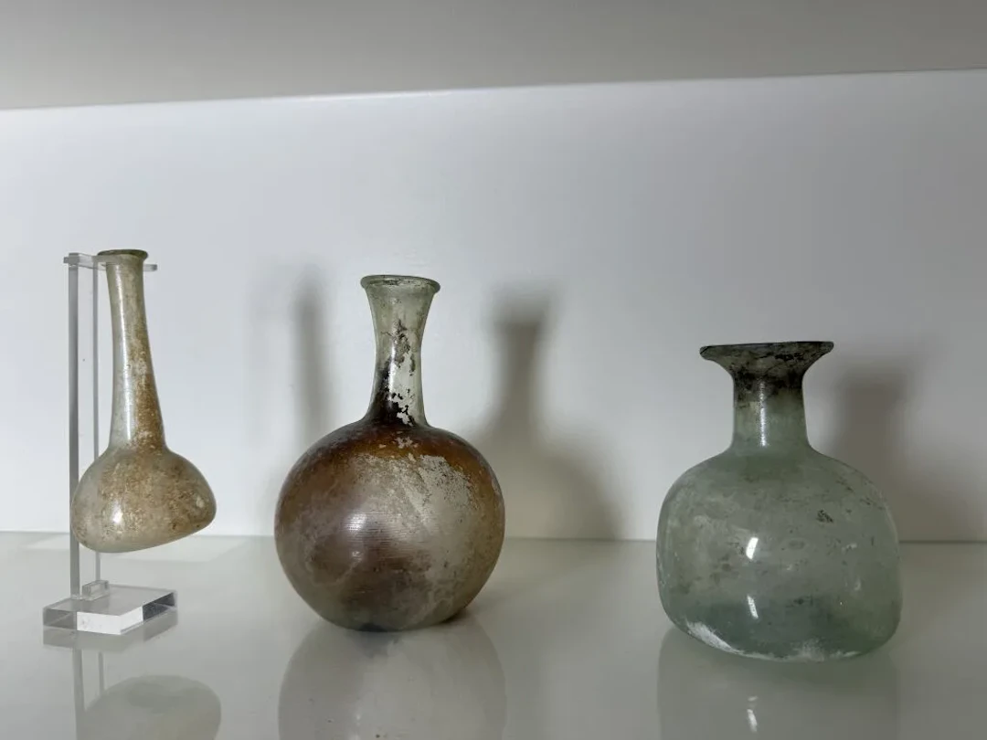 Set of three glass vases or flasks in the antique style. Height of