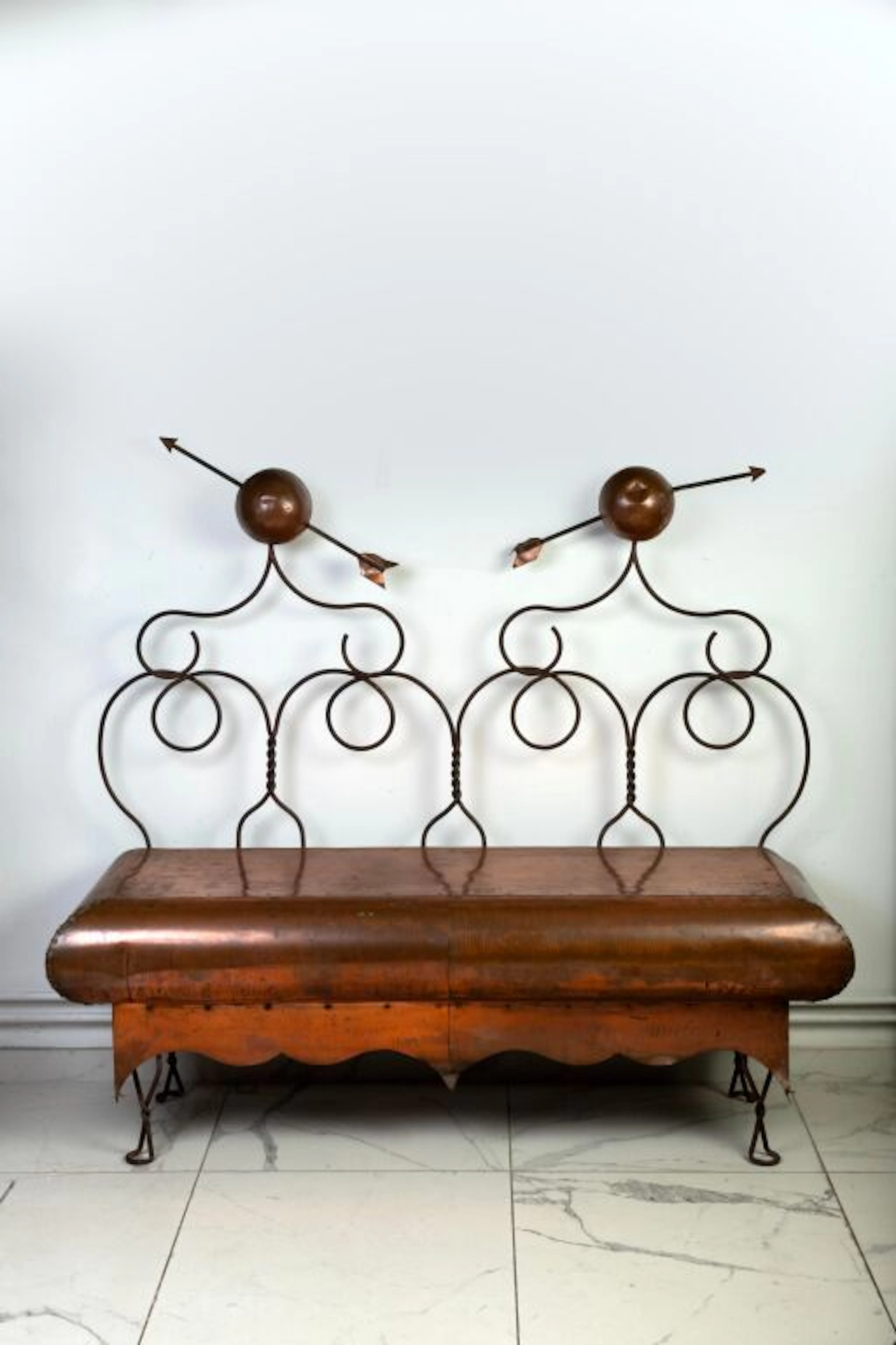 Wrought-iron bench with a double, openwork backrest in the shape of