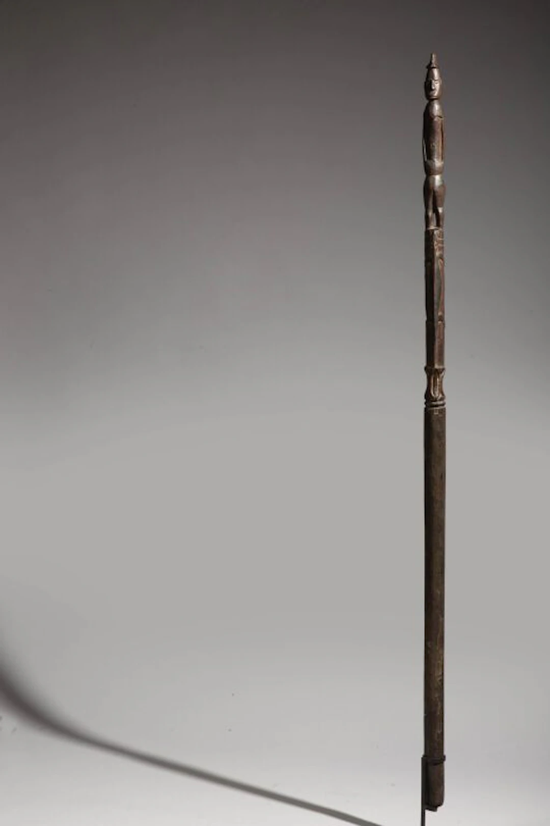 A rare walking stick carved with a standing figure and two lizards