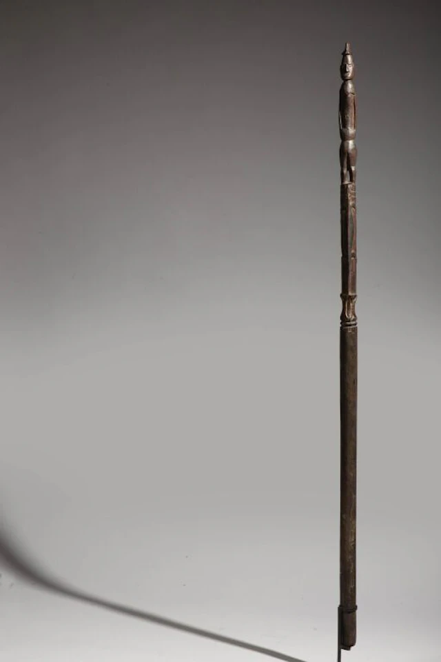 A rare walking stick carved with a standing figure and two lizards