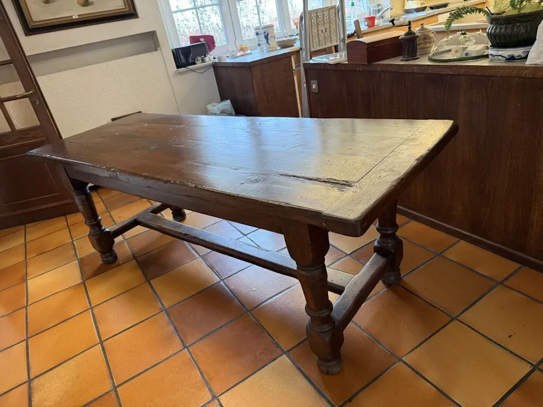 Lorraine-style dining table in waxed oak. The four baluster legs are