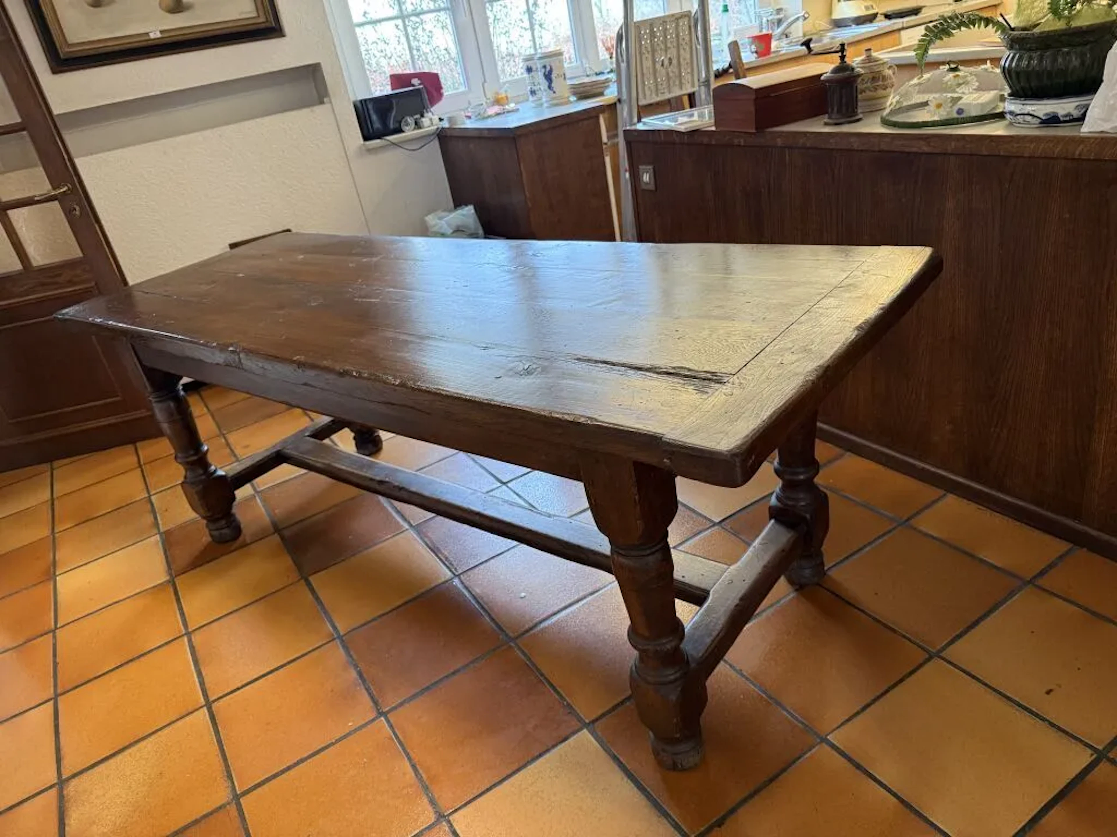 Lorraine-style dining table in waxed oak. The four baluster legs are