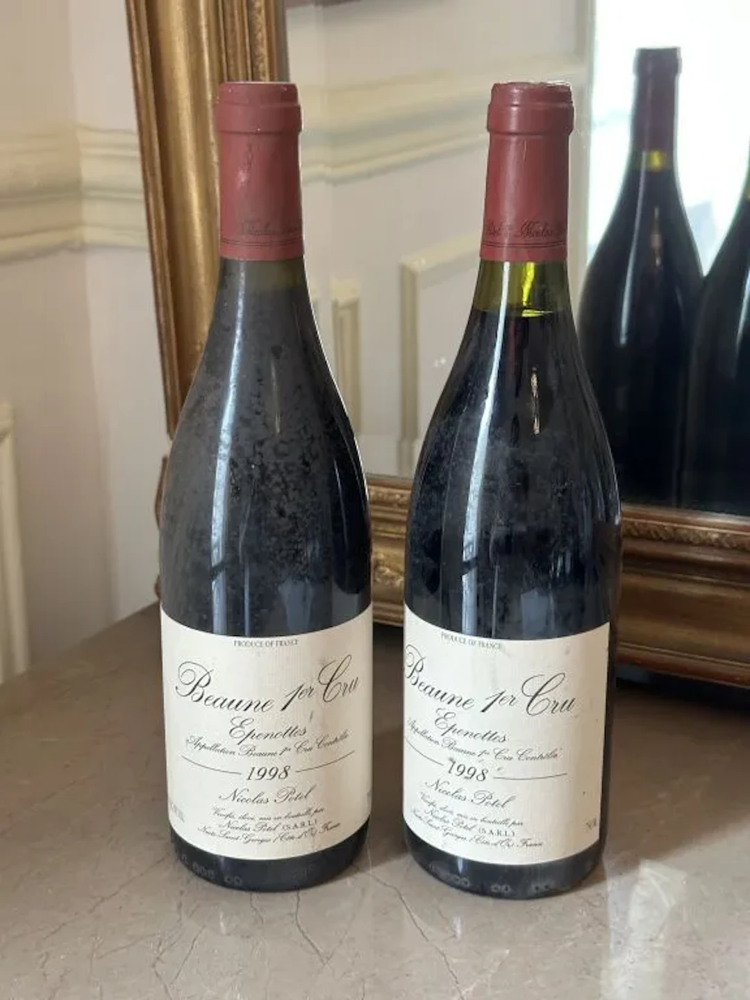 BEAUNE 1er Cru "Epenottes" 1998 - Domaine Nicolas Potel. Stained labels.