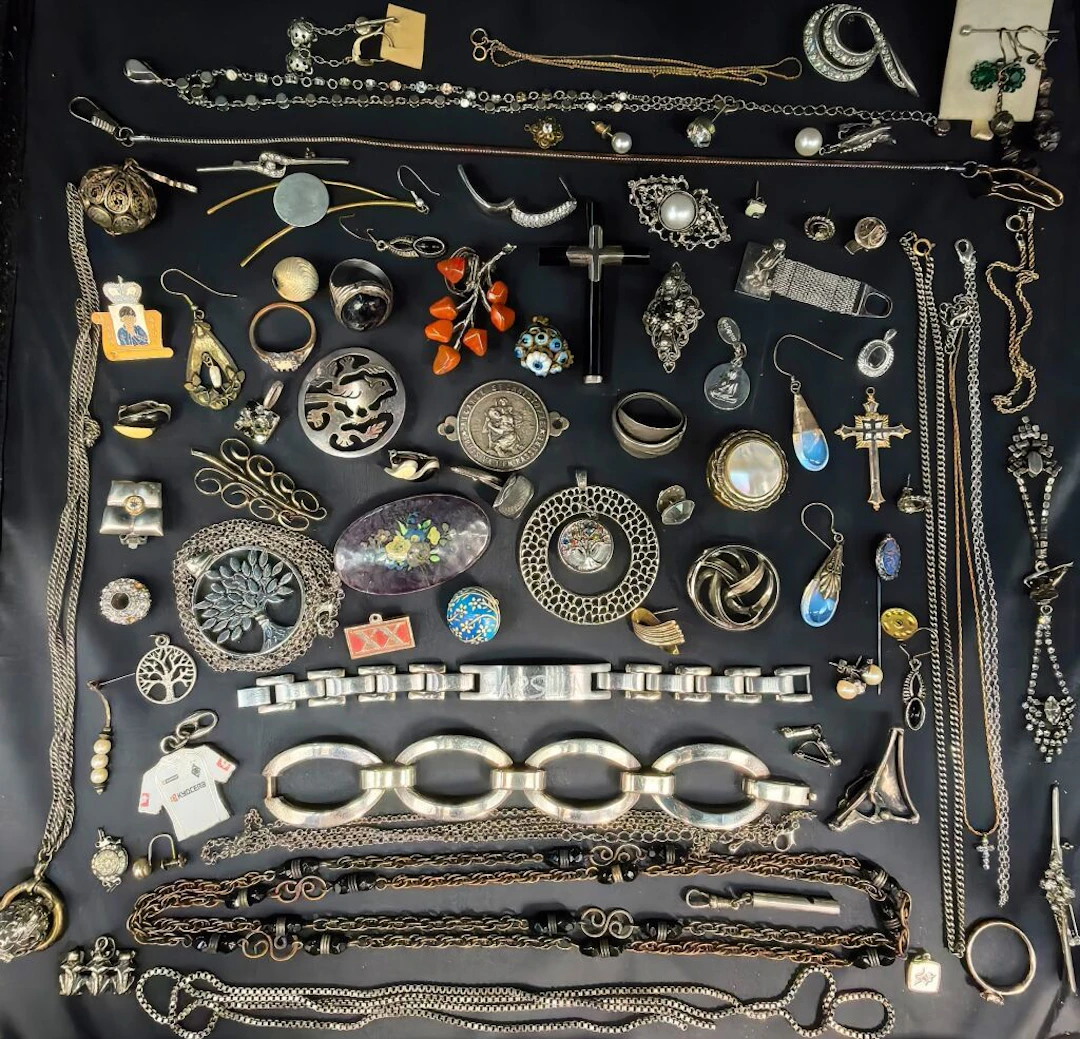 A large collection of costume jewelry and watches made of base metals—whether