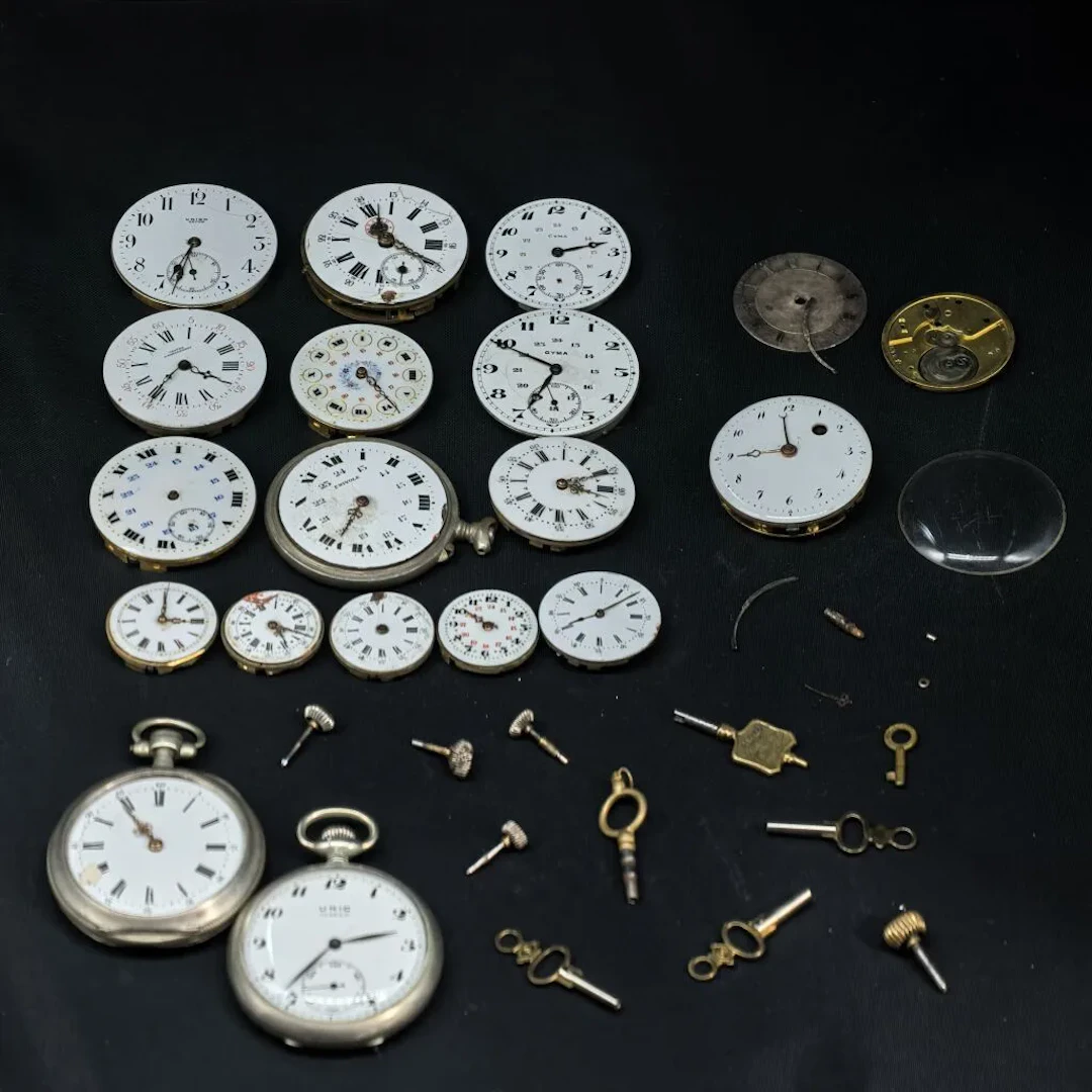 LOT: Base metal timepieces, watches and spare parts, movements, and