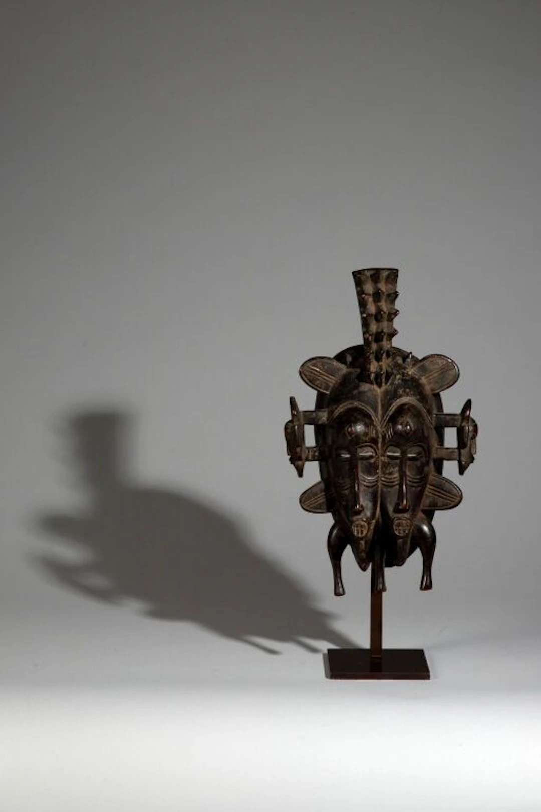 Double Kpelié mask topped with a spiny ornament—a rare feature—and