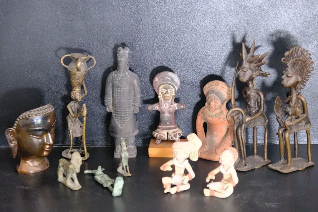 Collection of travel souvenirs or museum reproductions, including