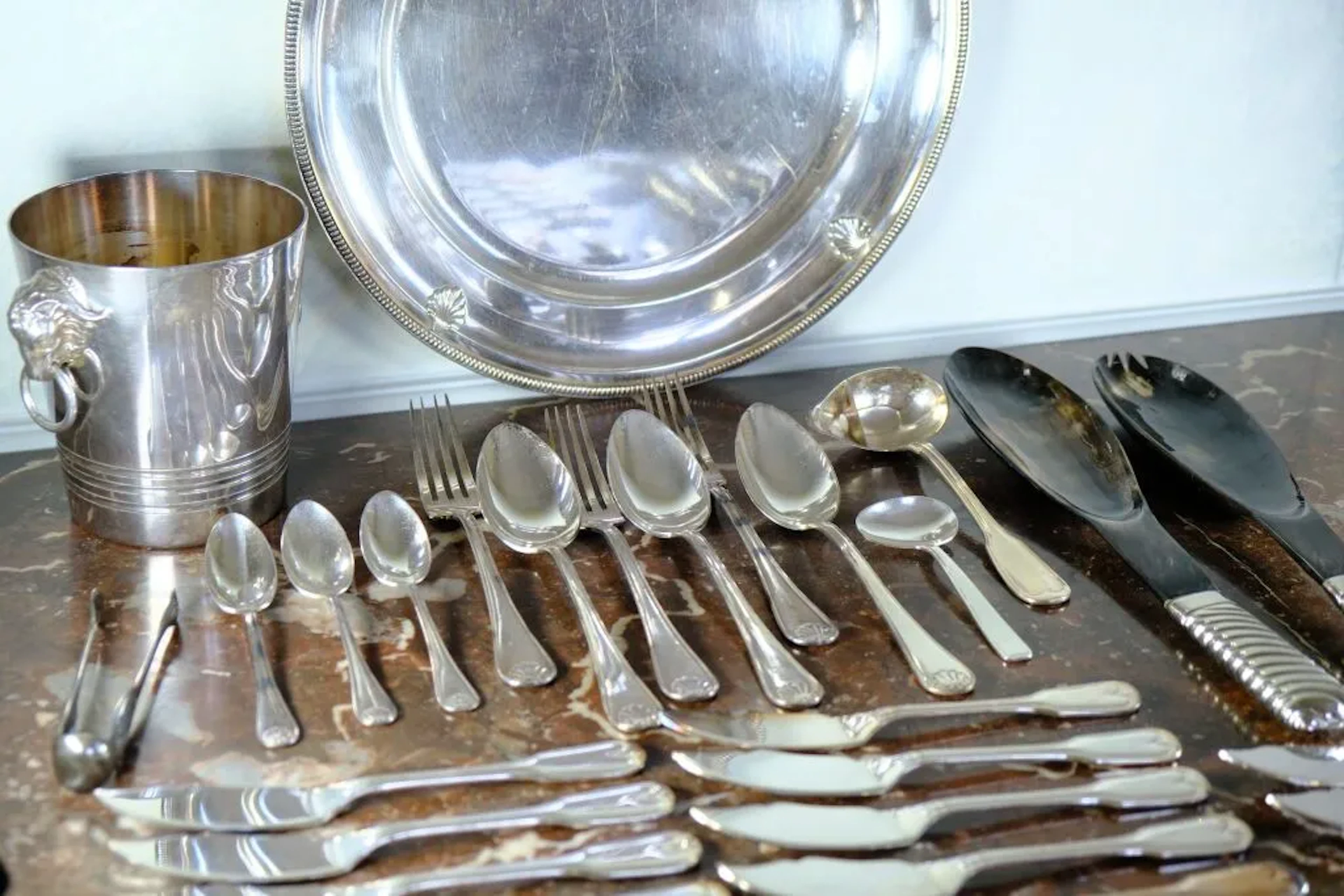 Silver plated set including: - a circular tray, three place settings