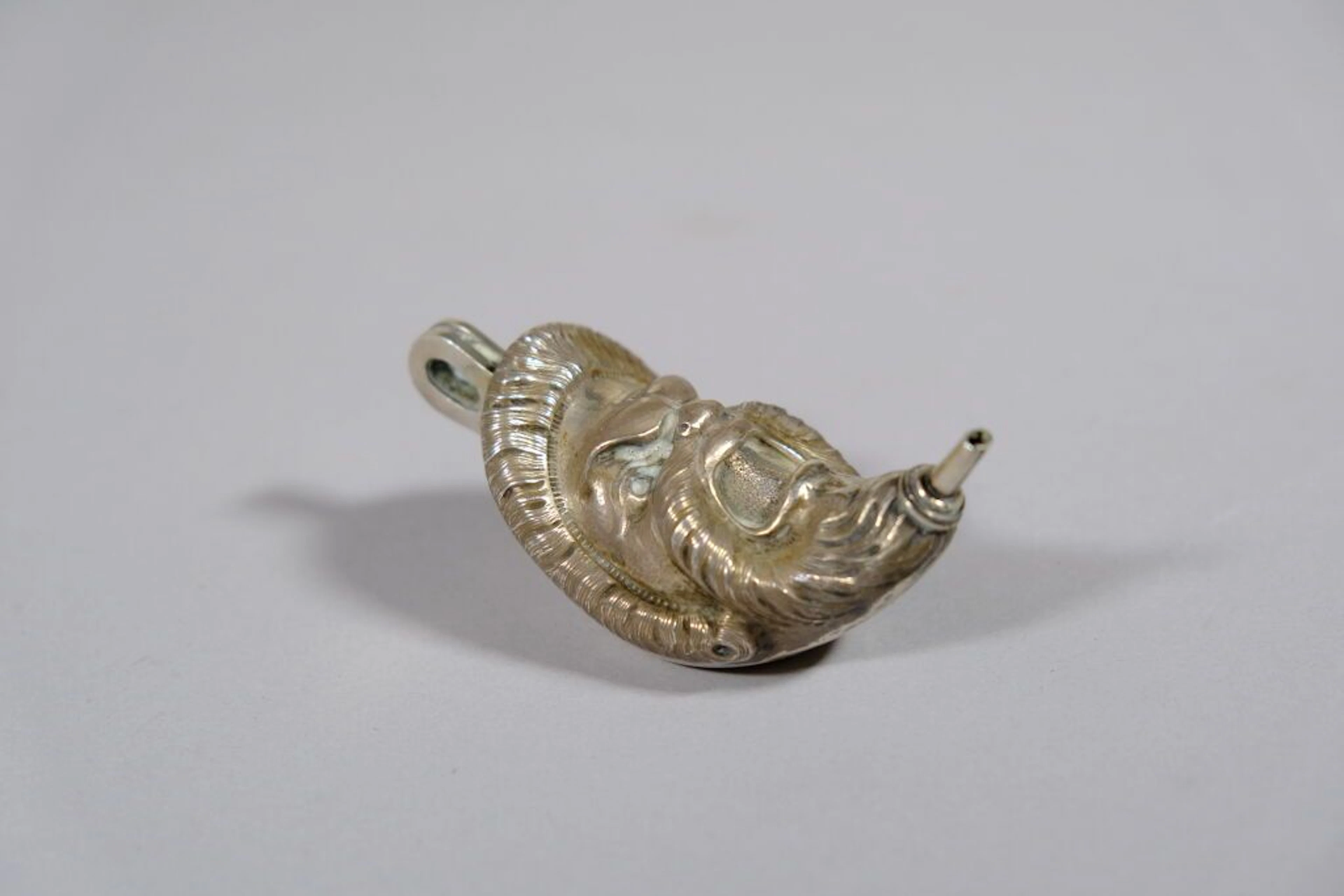 800/1000 silver oil lamp in the shape of a grimacing face. Export
