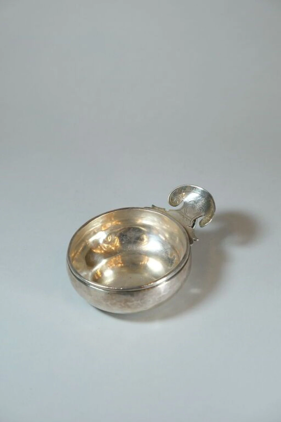 800/1000 silver tastevin with a boar's head hallmark, bearing the