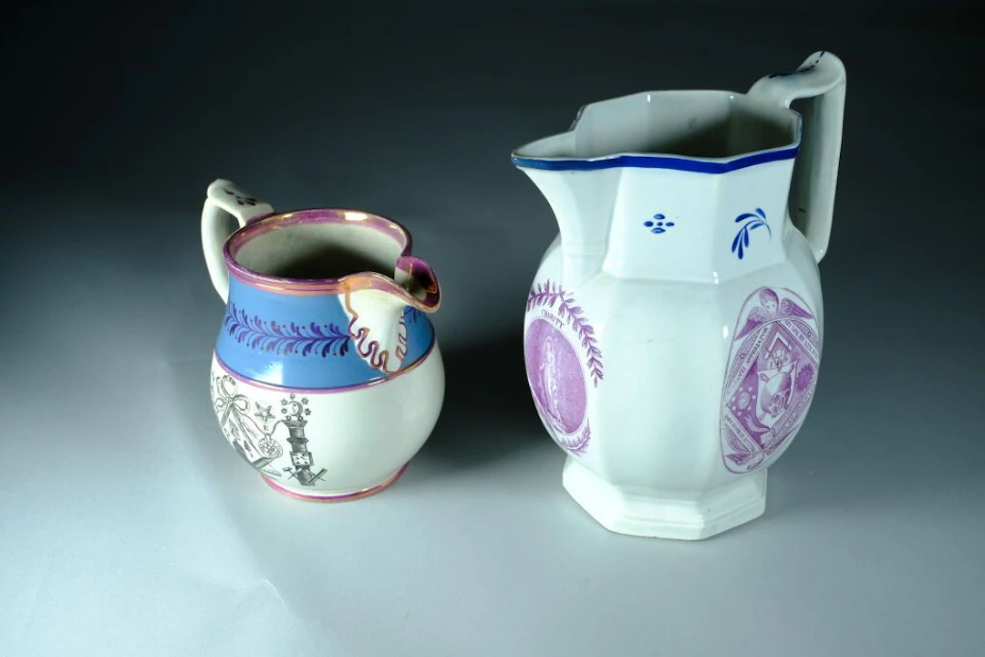 Set consisting of two pitchers decorated with Masonic motifs: - One