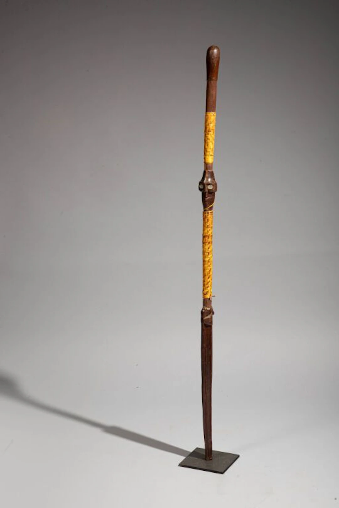 Cane decorated with two Janus heads with mother-of-pearl inlaid eyes