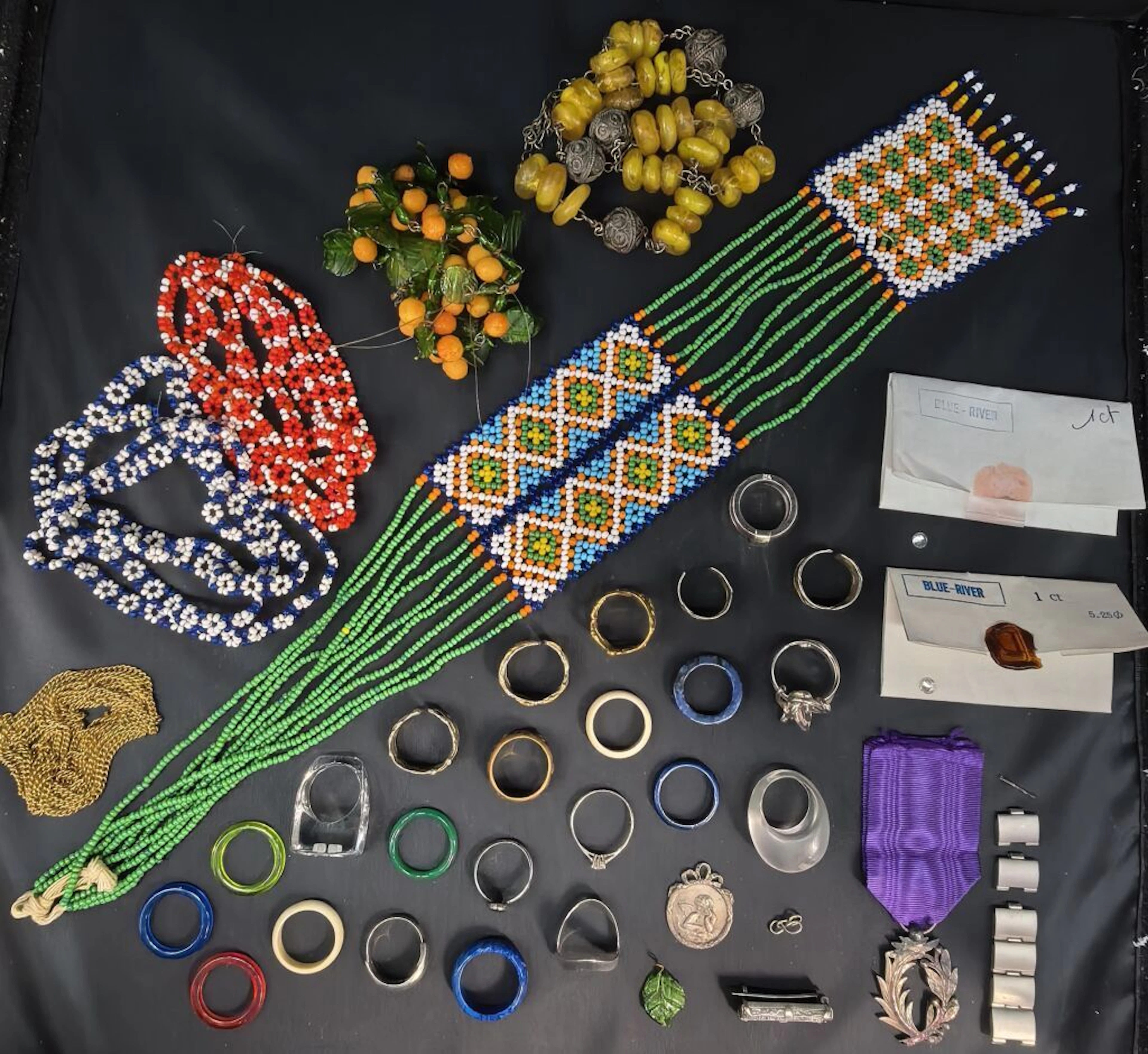 A set of "detox" costume jewelry featuring imitation stone rings
