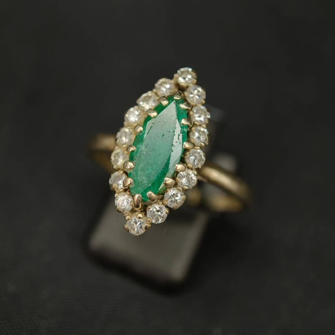 A 750‰ white gold and 950‰ platinum “navette” ring, set with a shaped