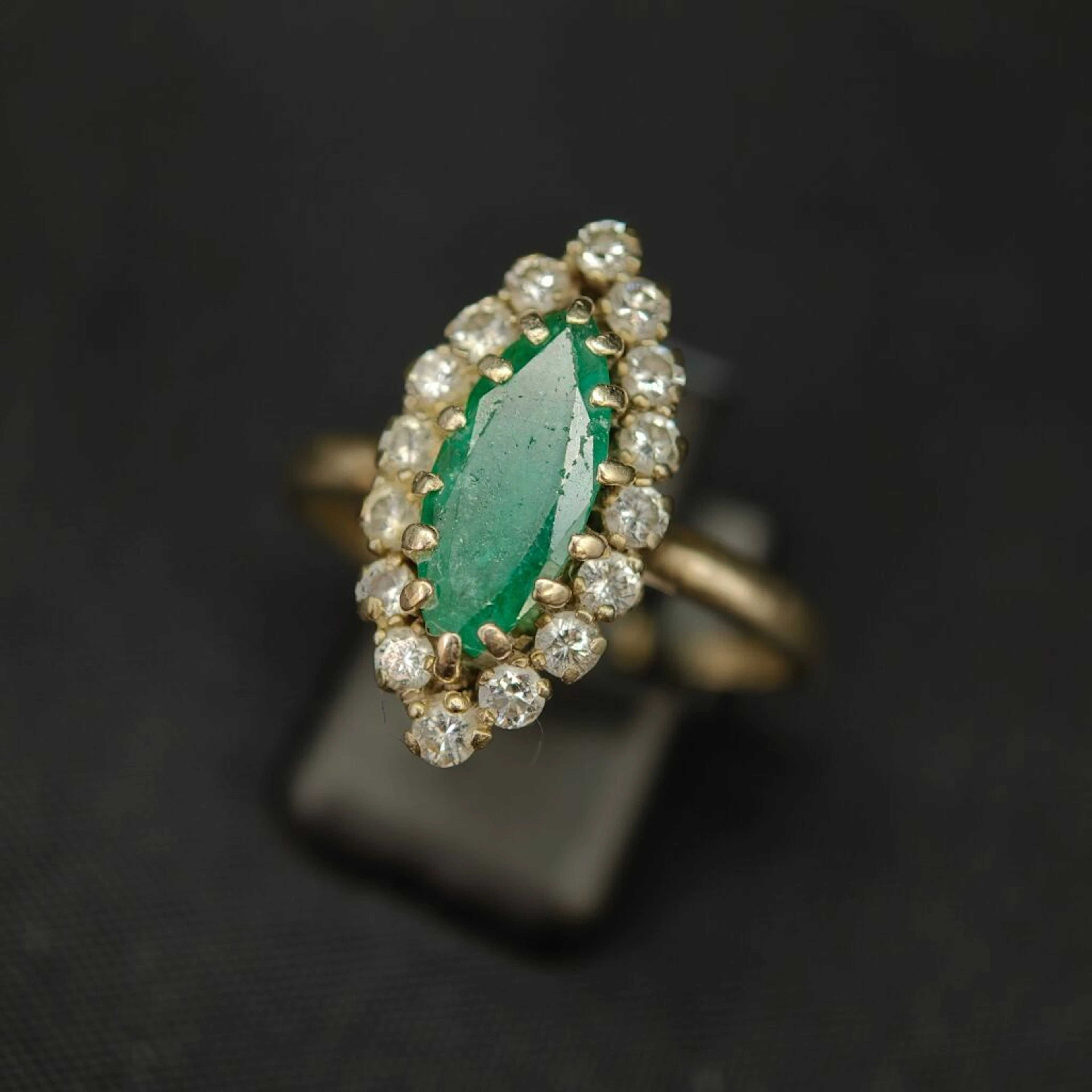 A 750‰ white gold and 950‰ platinum “navette” ring, set with a shaped