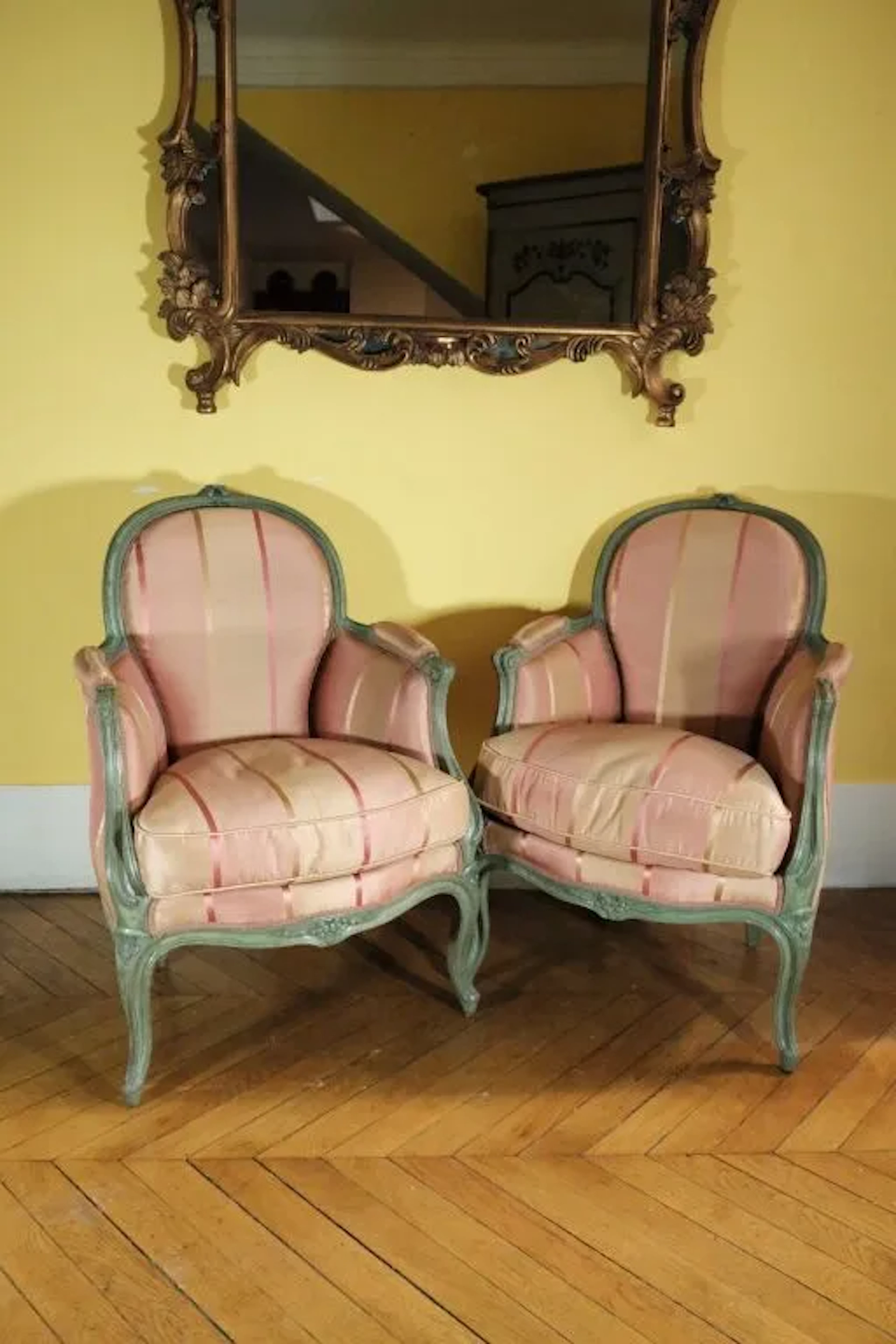 Pair of small wooden armchairs with molded, green-lacquered frames