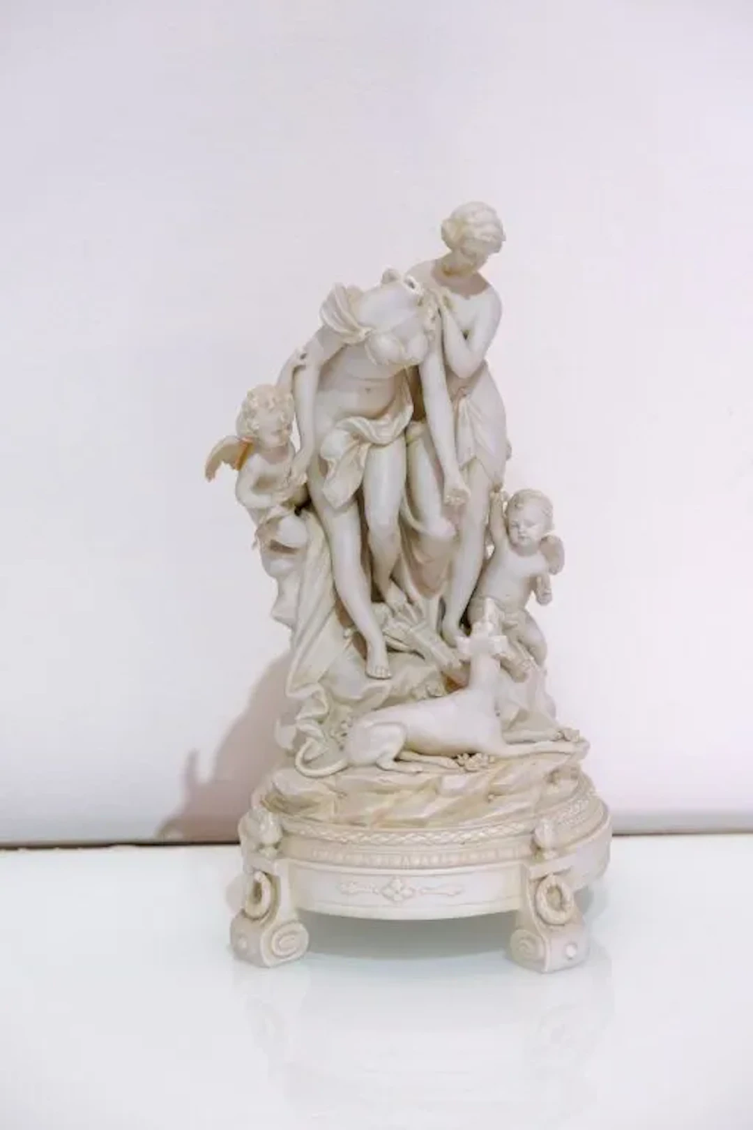 A biscuit figurine set in the Claudion style, depicting Diana the