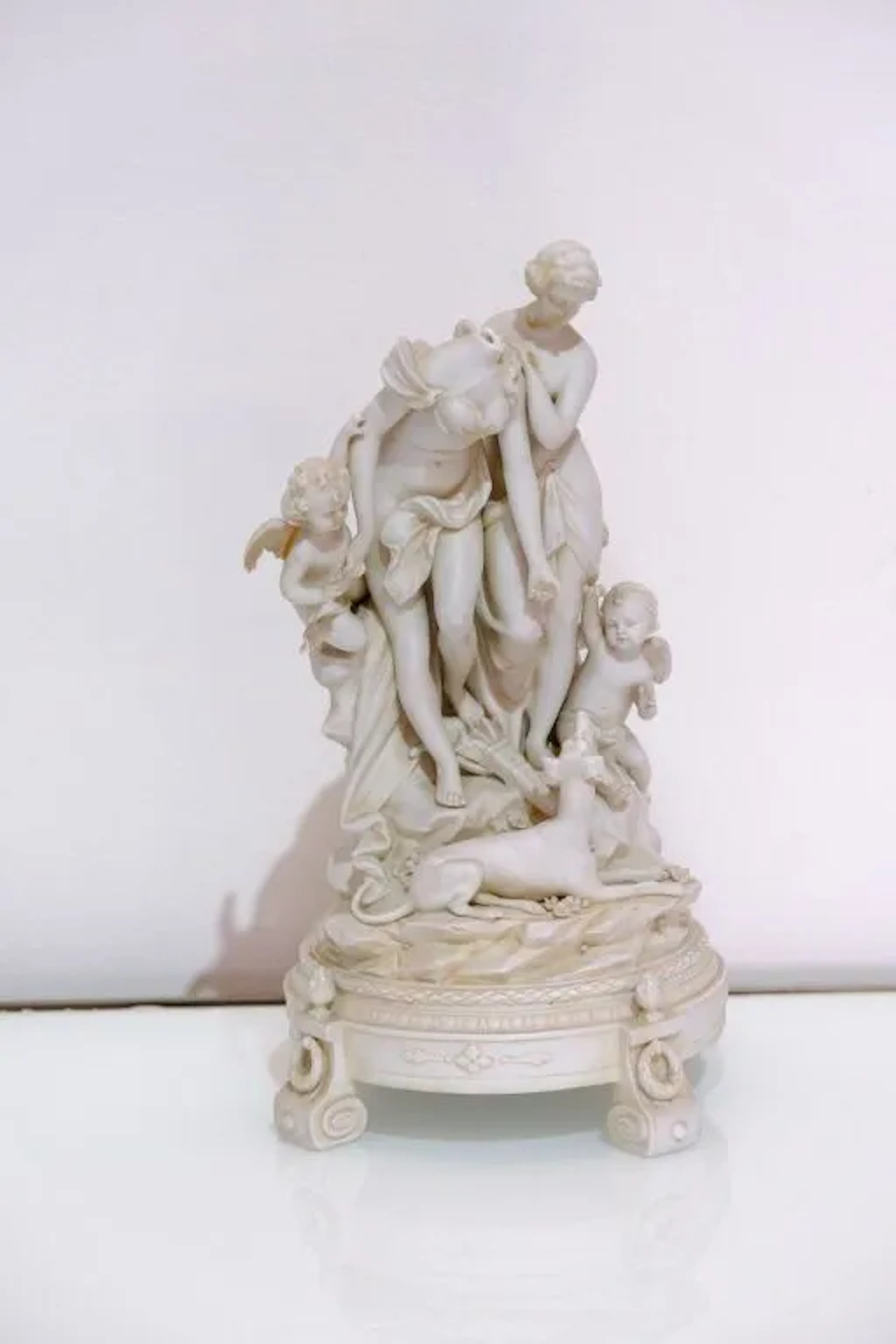 A biscuit figurine set in the Claudion style, depicting Diana the