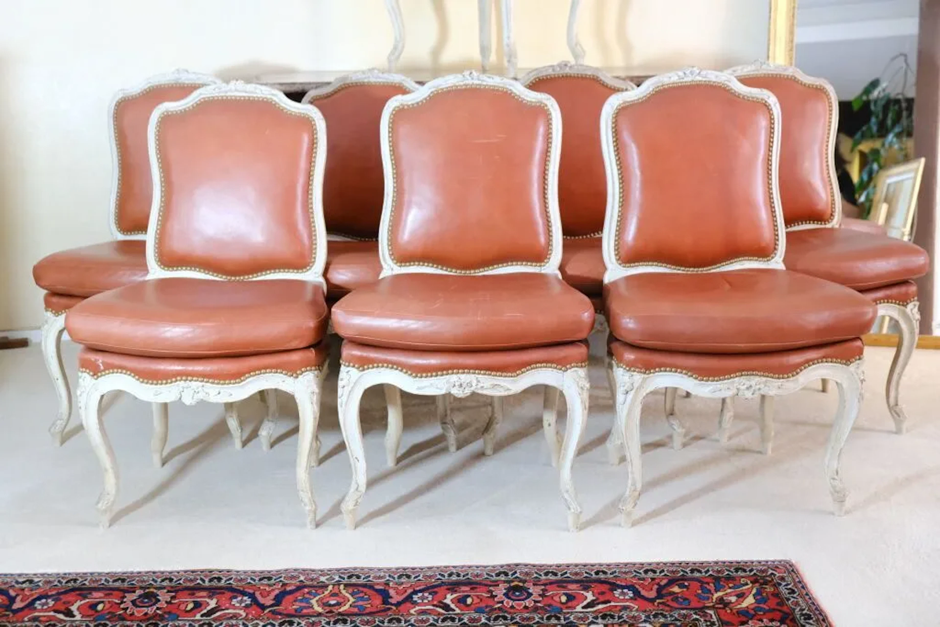 Set of eight chairs in molded and carved wood, refinished in cream