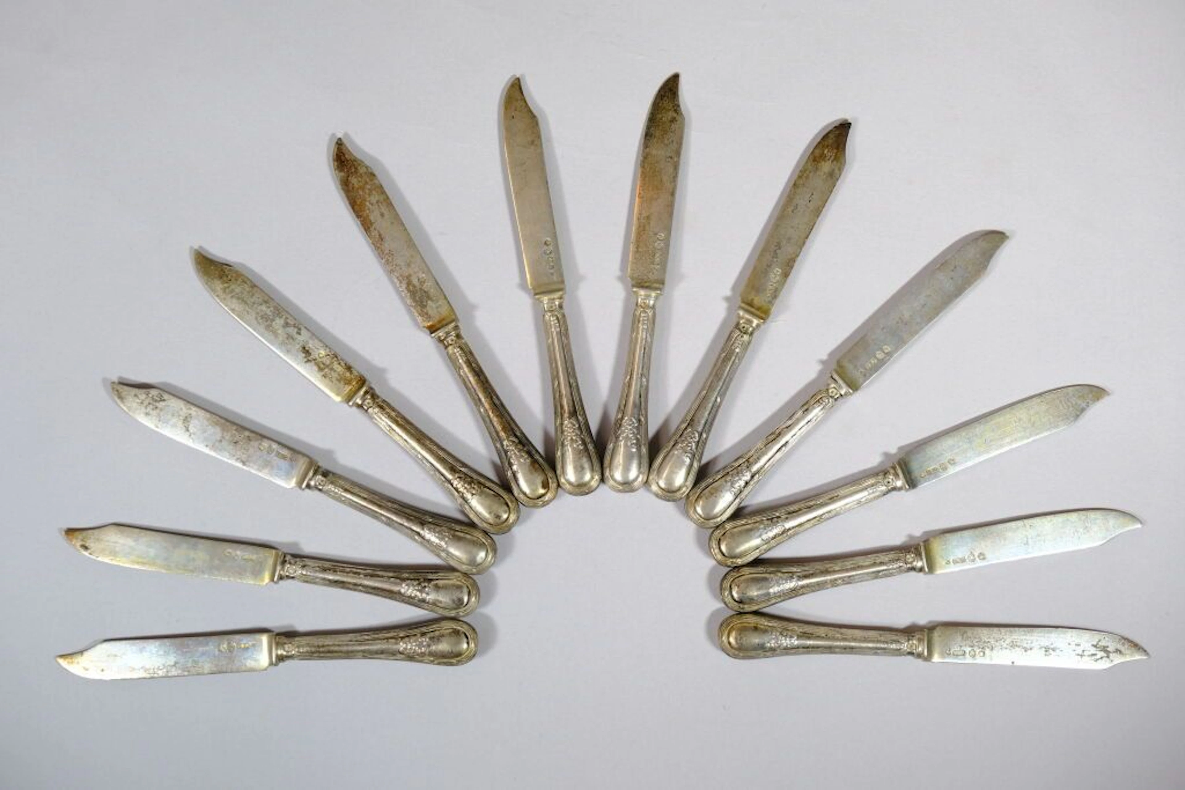 Set of 12 fruit knives, with blades in 800/1000 silver bearing the