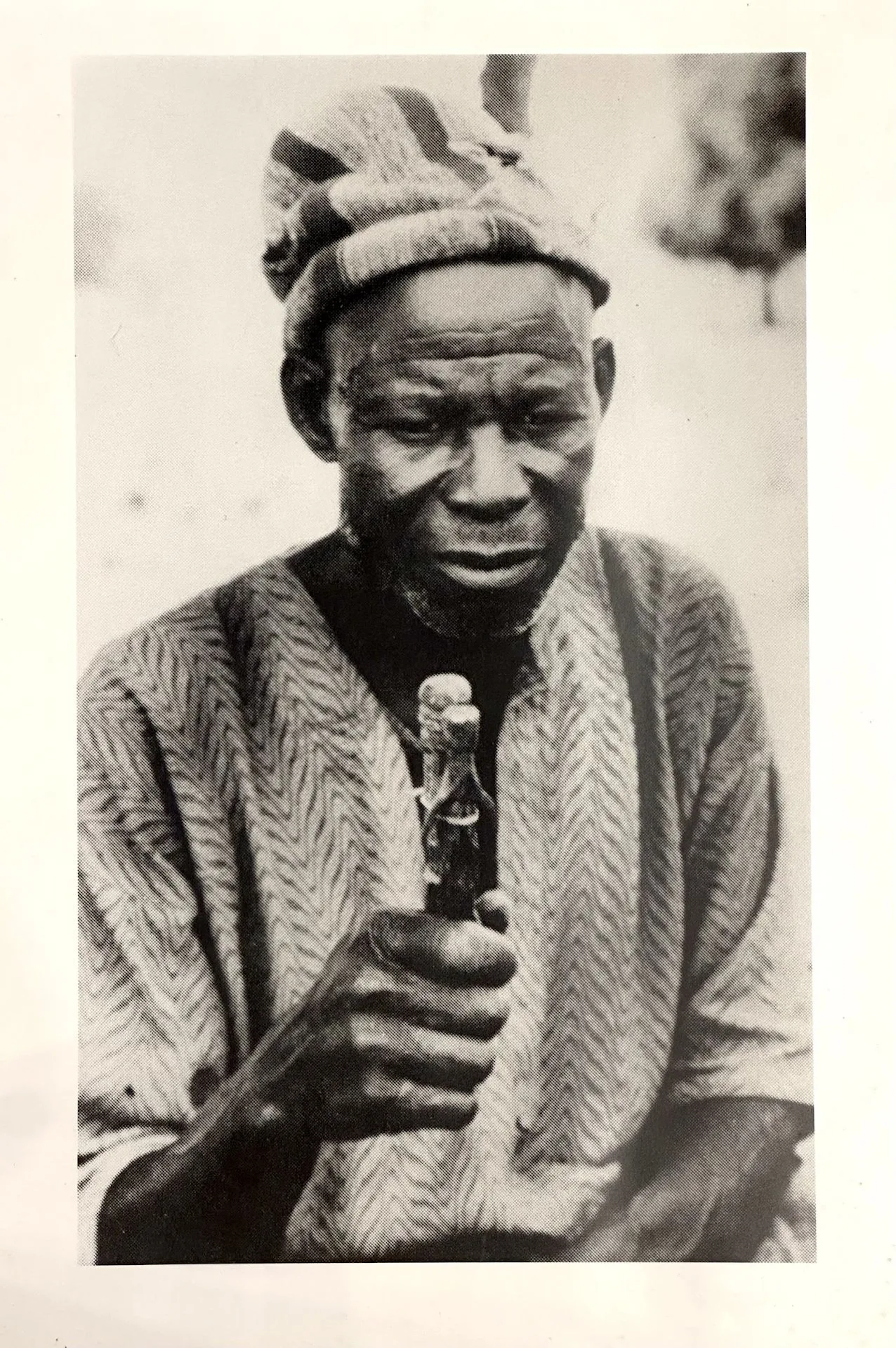 Late 20th–21st century. Black-and-white photograph depicting a man