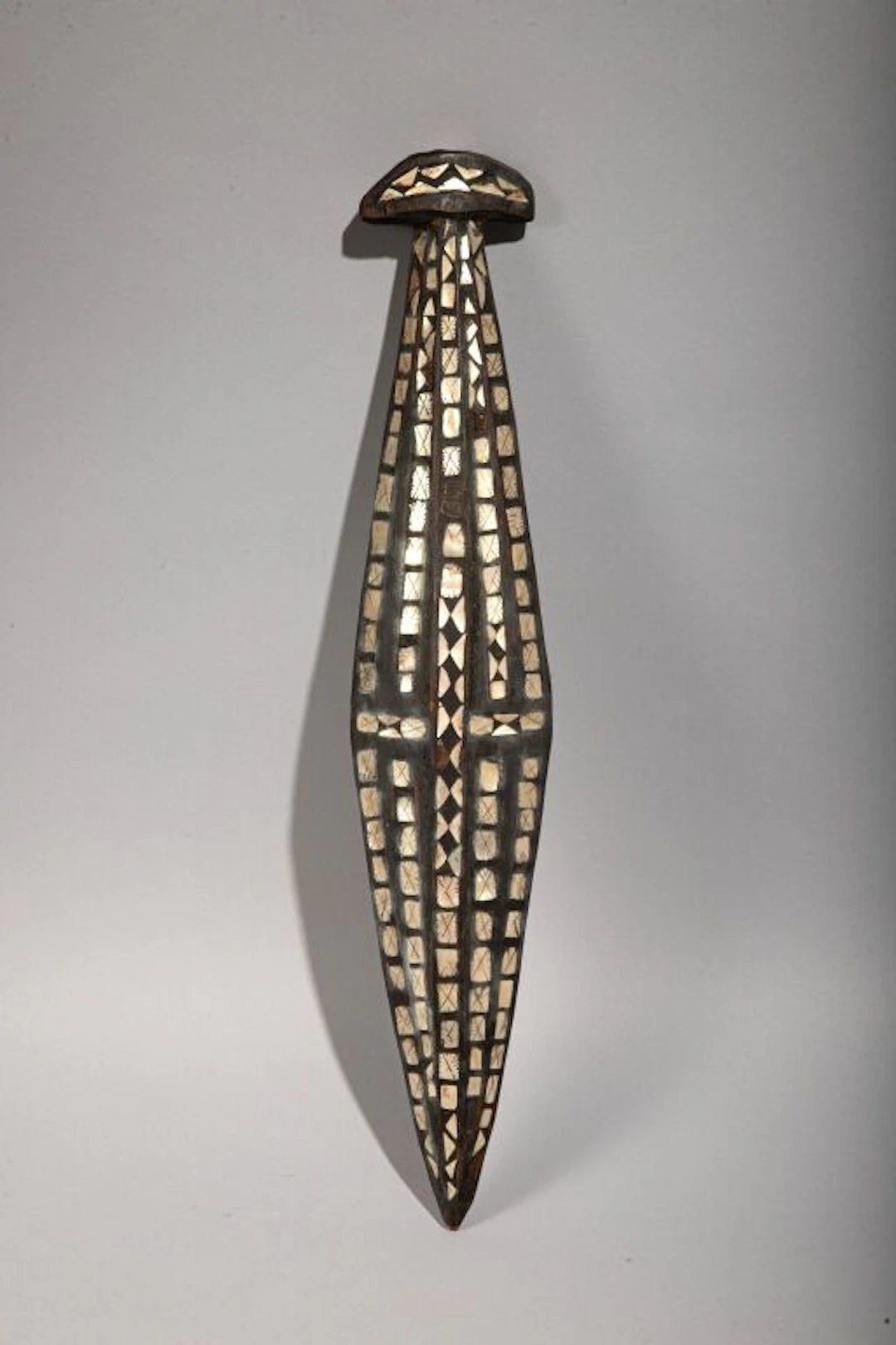 Short club entirely inlaid with mother-of-pearl. Solomon Islands