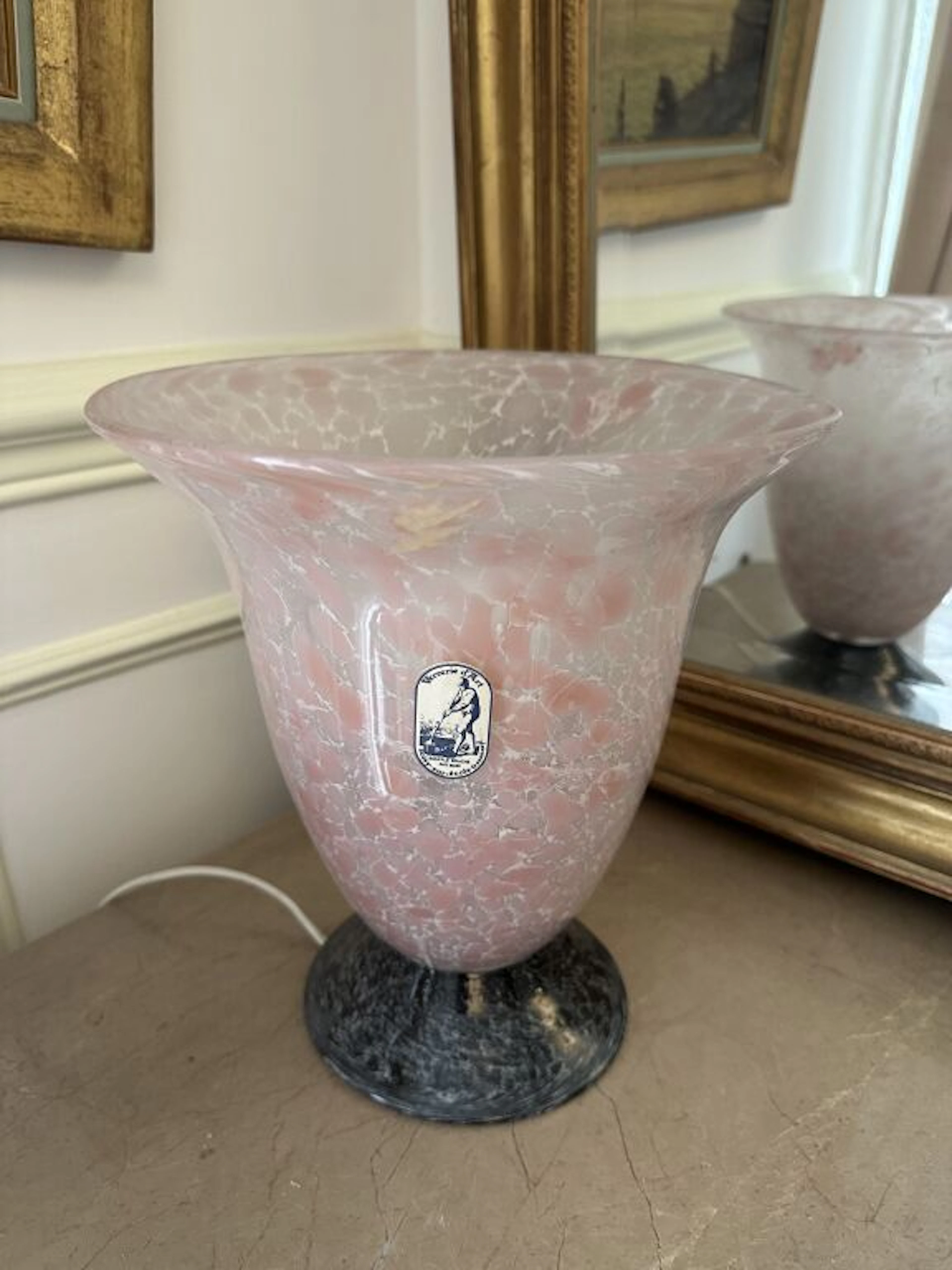 SOISY Glassworks. Light pink and white glass lamp with a flared neck
