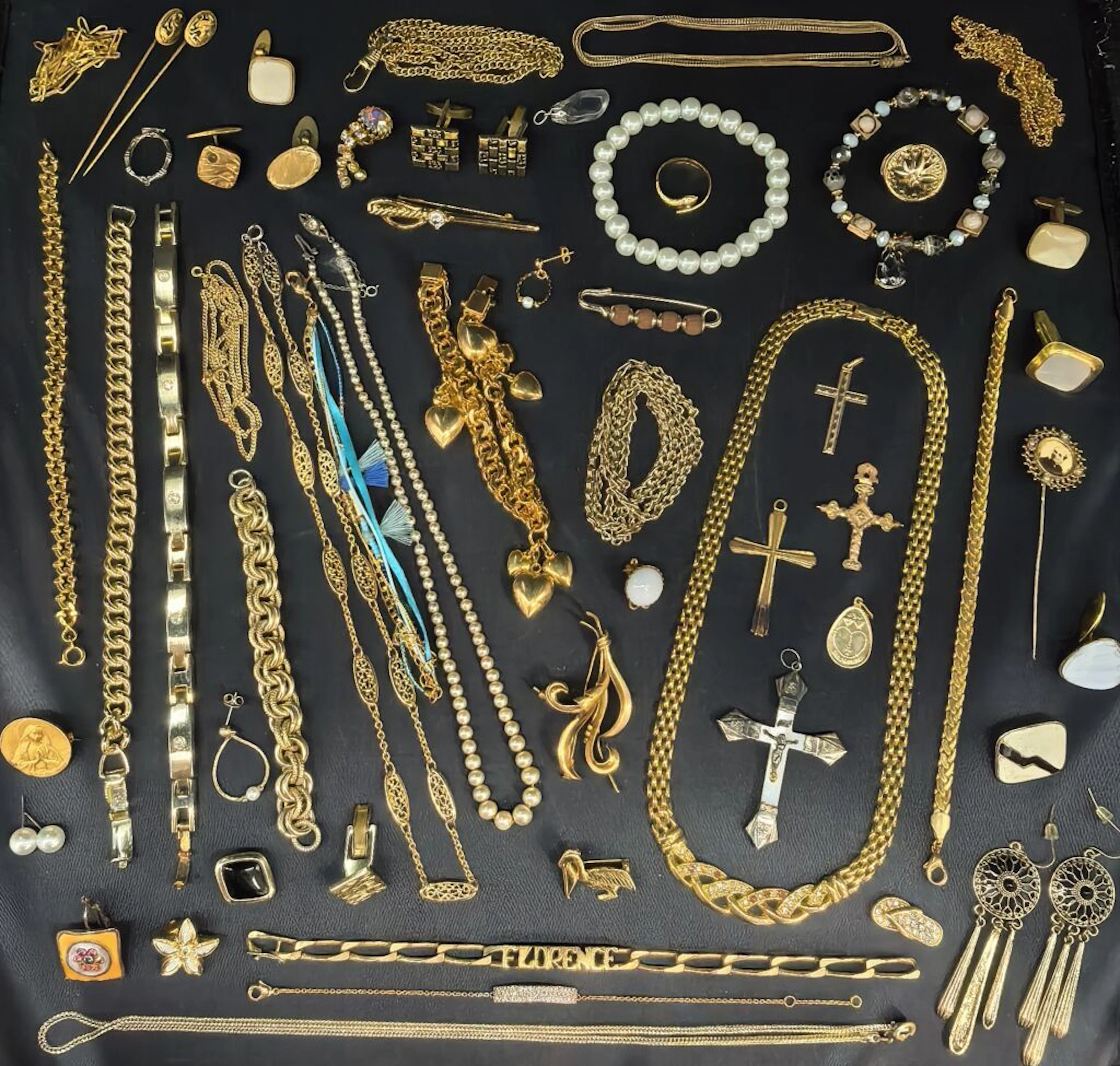 A set of costume jewelry consisting of necklaces, bracelets, watches