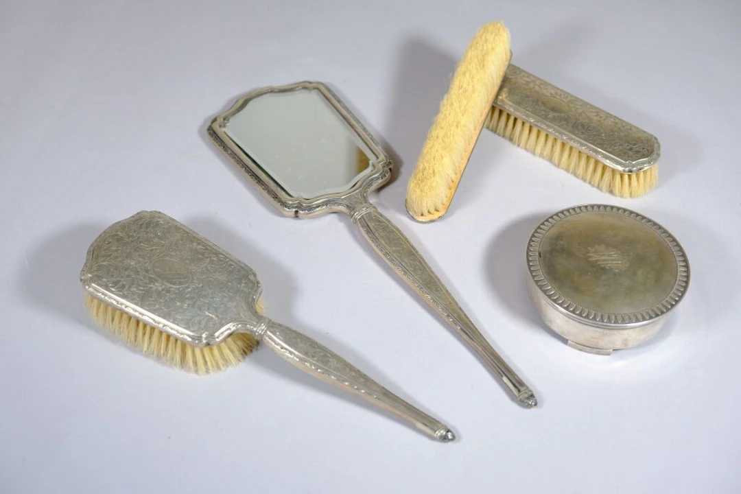 GERMANY. 800/1000 silver toiletries set with engraved foliage scrollwork