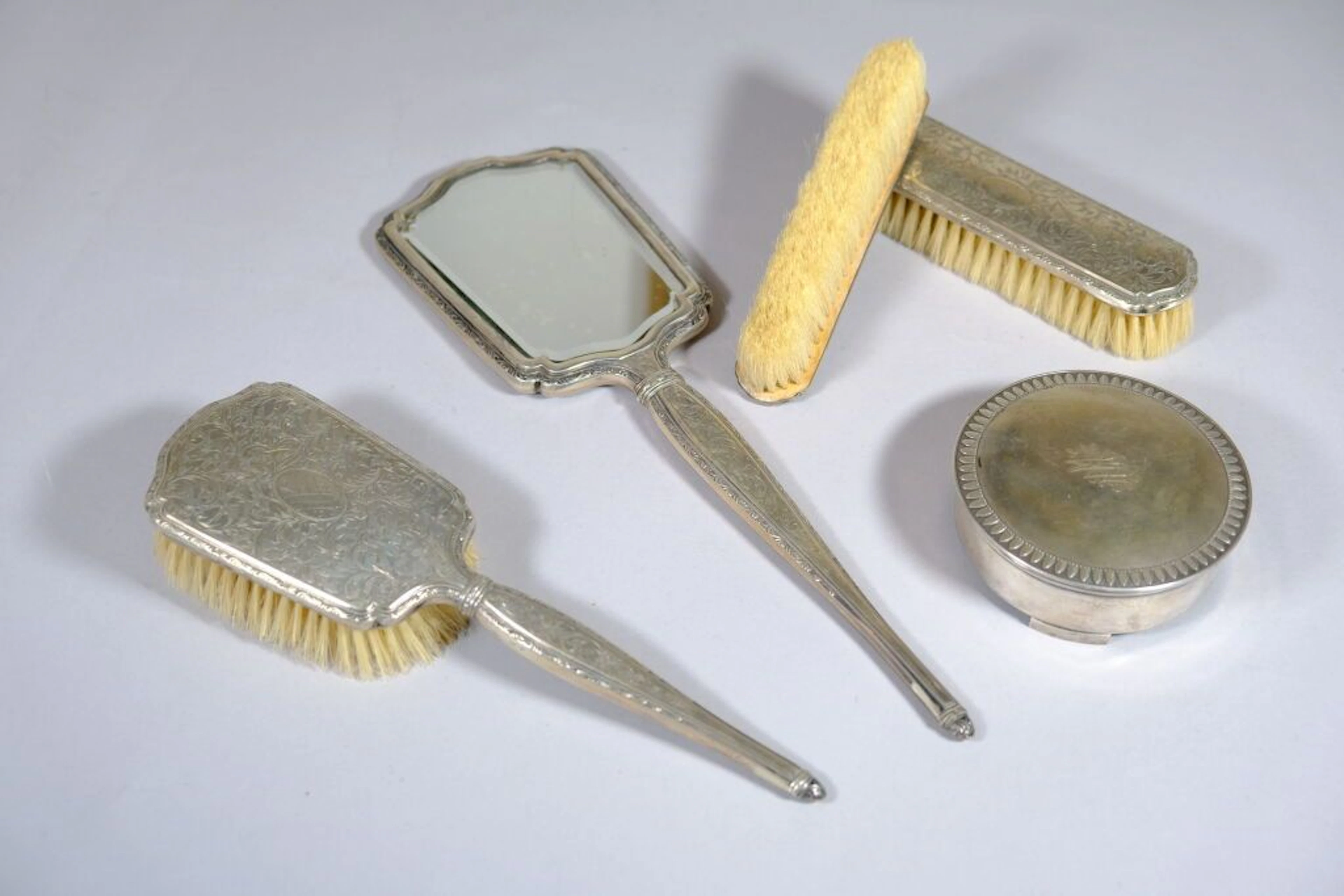 GERMANY. 800/1000 silver toiletries set with engraved foliage scrollwork