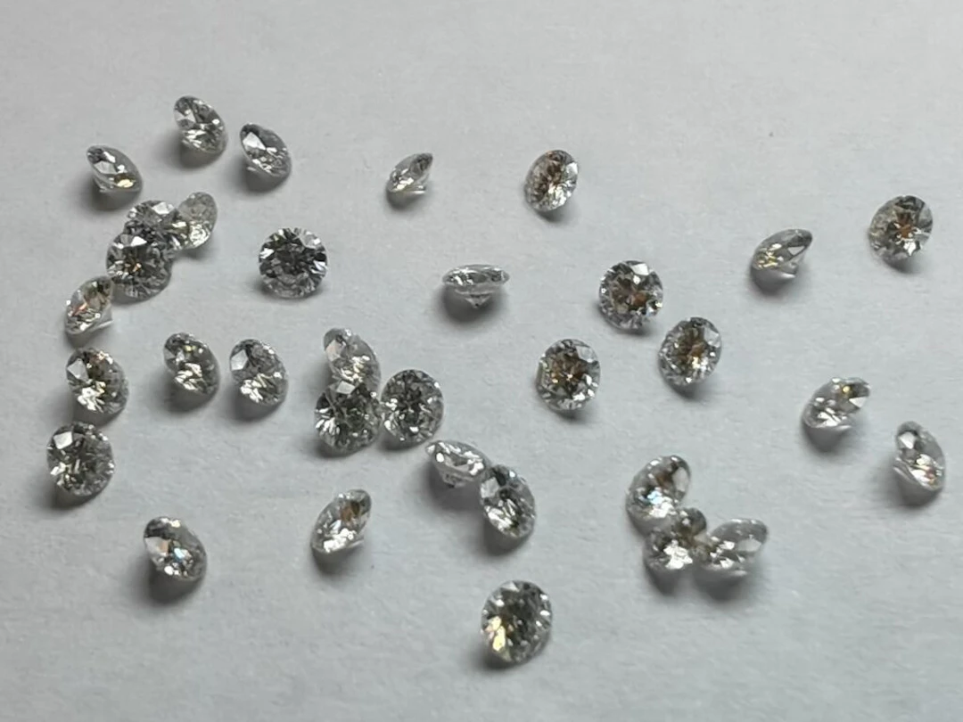 * Set of 41 brilliant-cut diamonds, each measuring 28-tenths, weighing