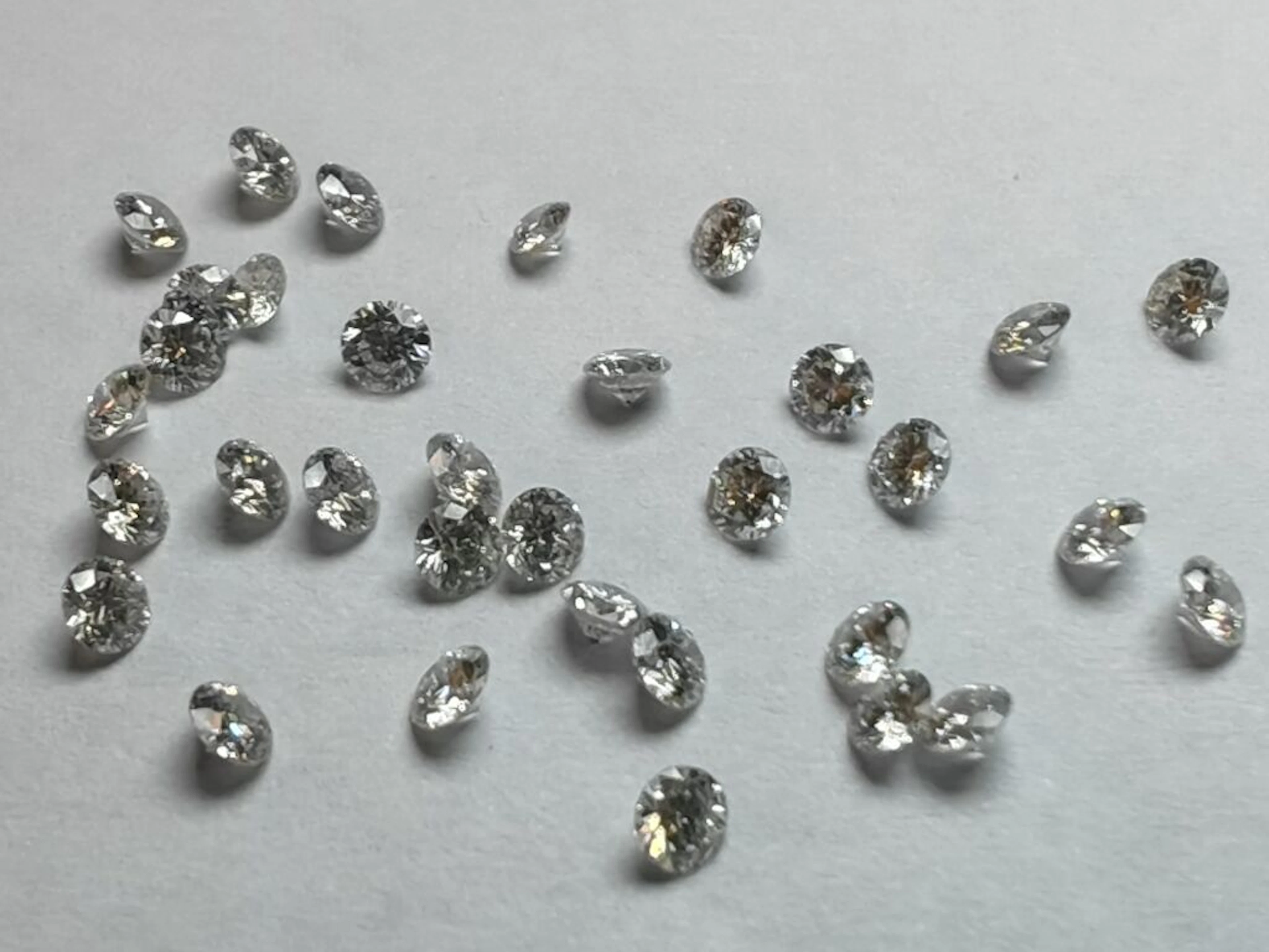 * Set of 41 brilliant-cut diamonds, each measuring 28-tenths, weighing