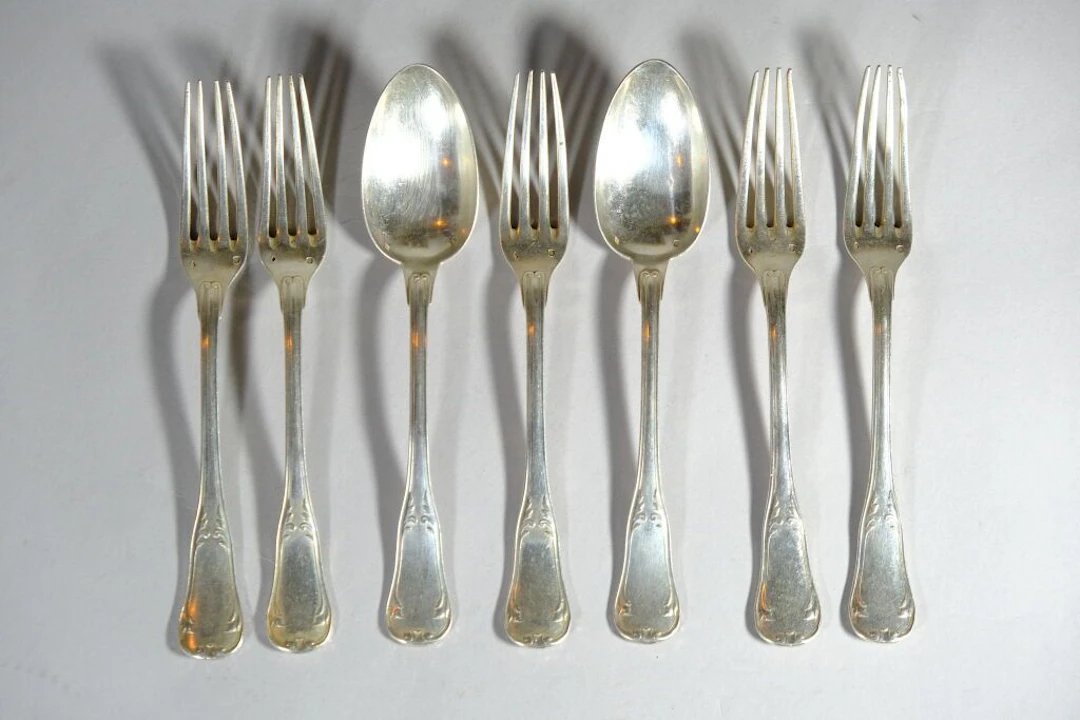 Émile PUIFORCAT. Set of 5 large forks and 2 large spoons in 925/1000
