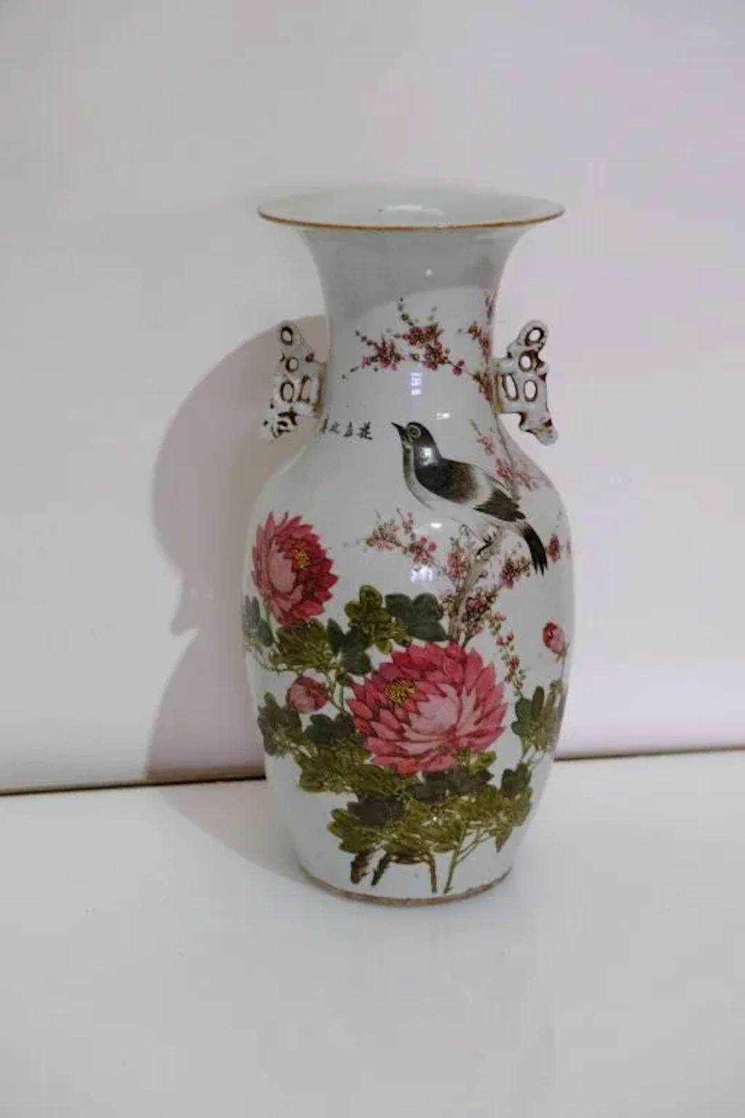 Porcelain baluster vase with polychrome and gold decoration featuring