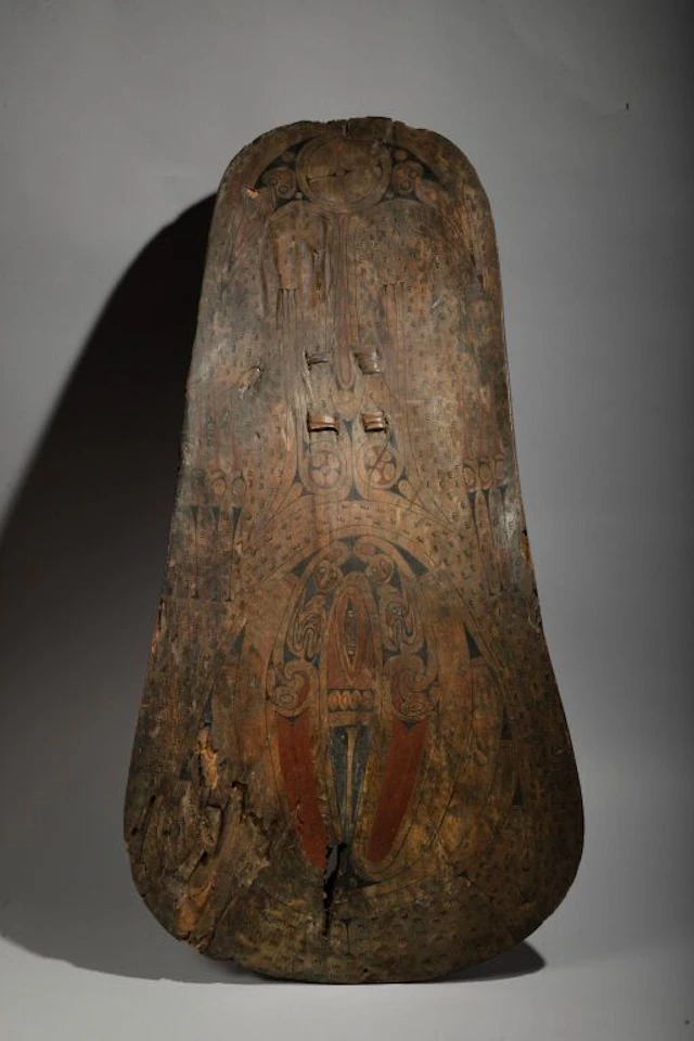 A rare, curved Vayola shield with fine, delicate painted decoration.