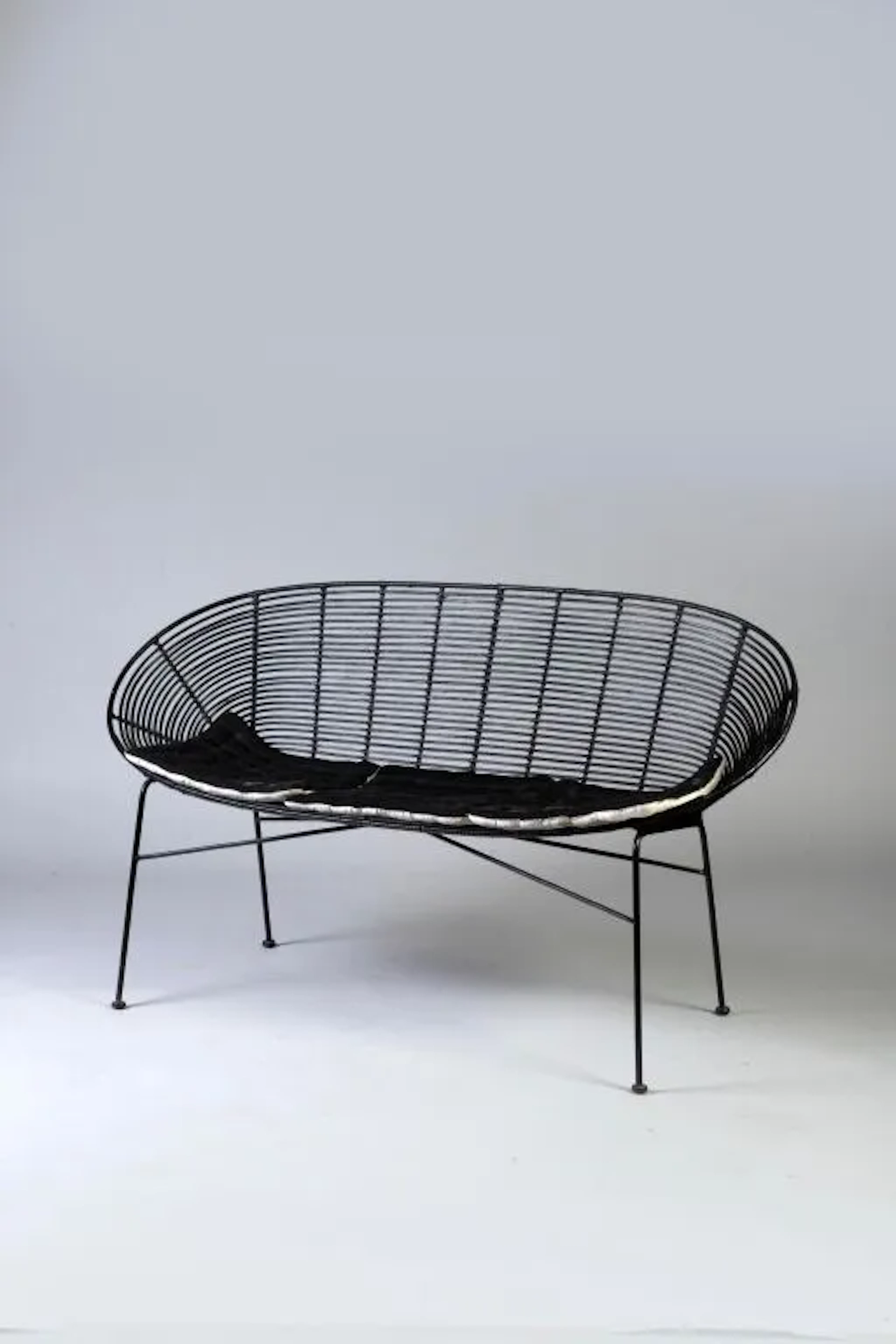 Rattan and metal bench. 84 x 150 x 57 cm. Items must be picked up