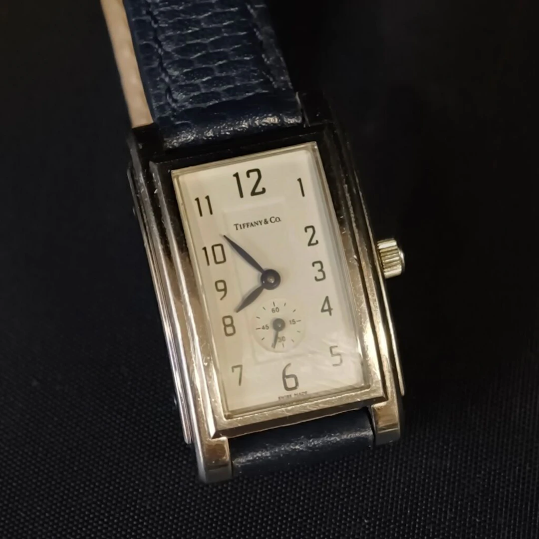 TIFFANY & Co., circa 1990. Women's stainless steel wristwatch, curved