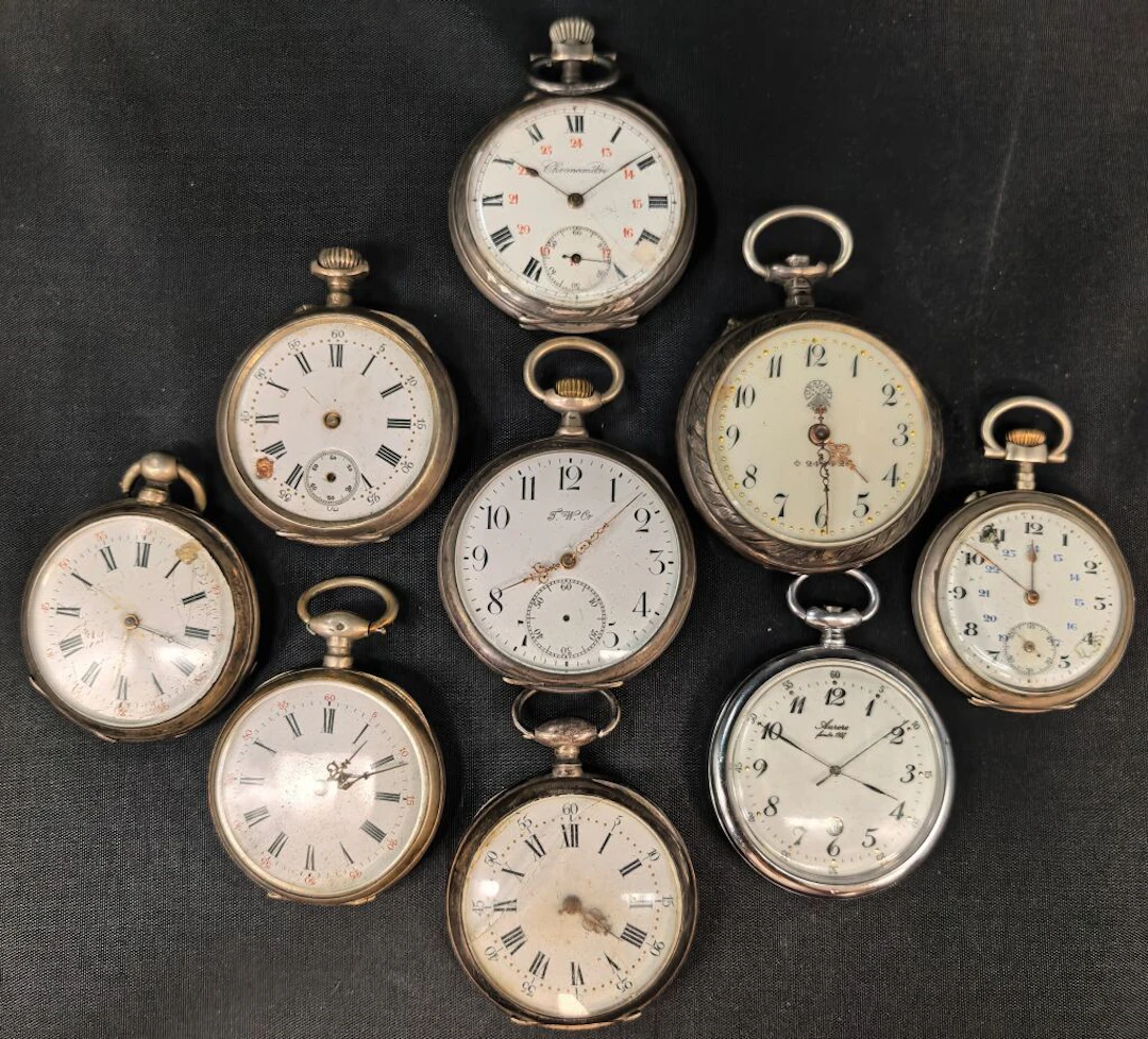 Set of nine pocket watches or regulators made of silver with a minimum