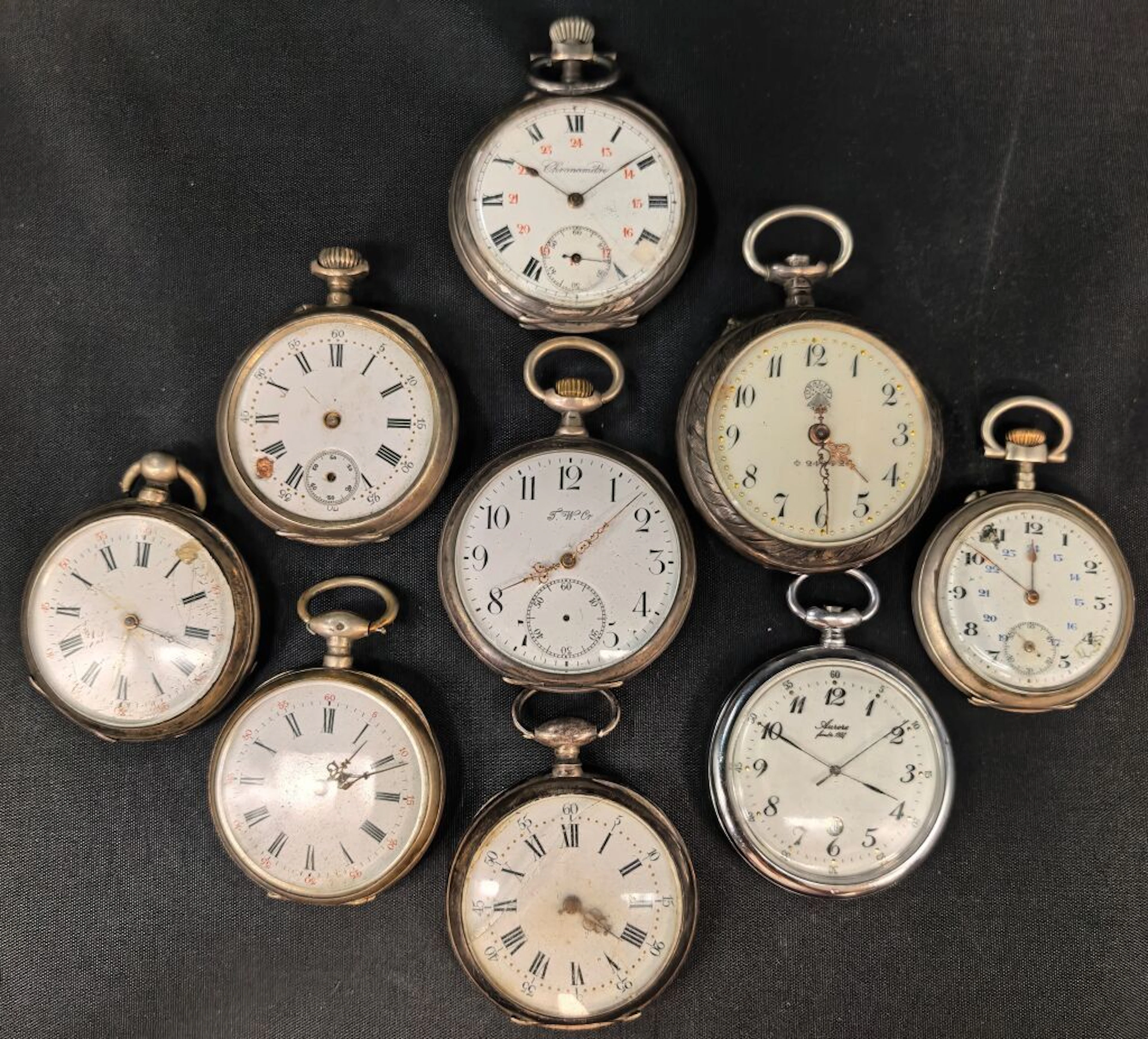 Set of nine pocket watches or regulators made of silver with a minimum
