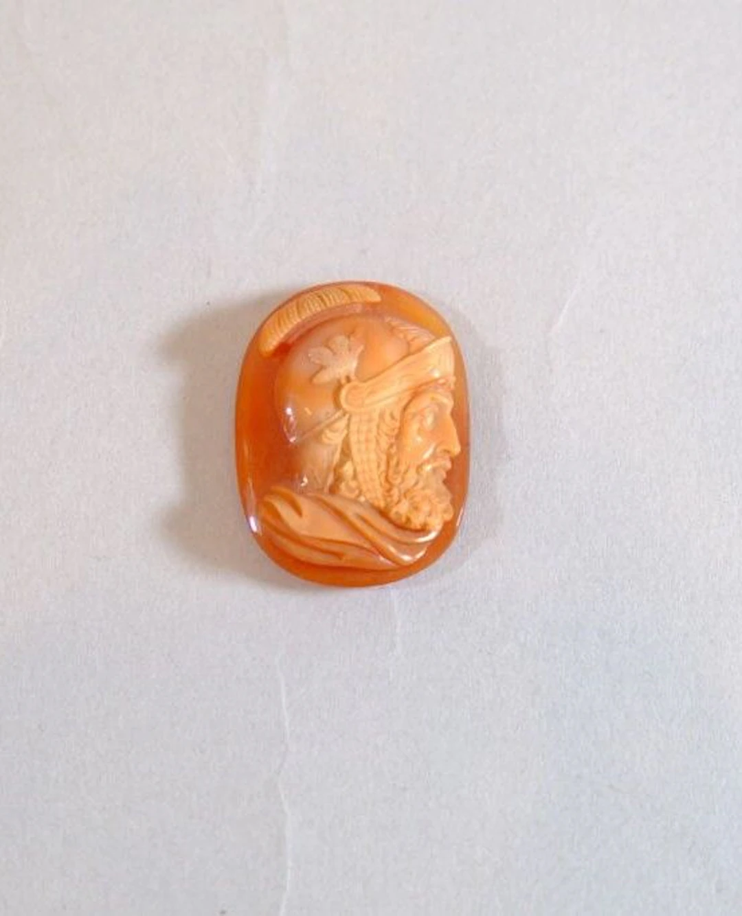 A cameo carved from multilayered carnelian depicting a man wearing