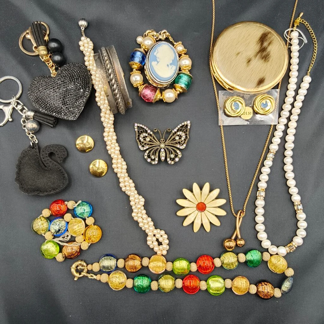 A collection of whimsical and fanciful costume jewelry featuring a