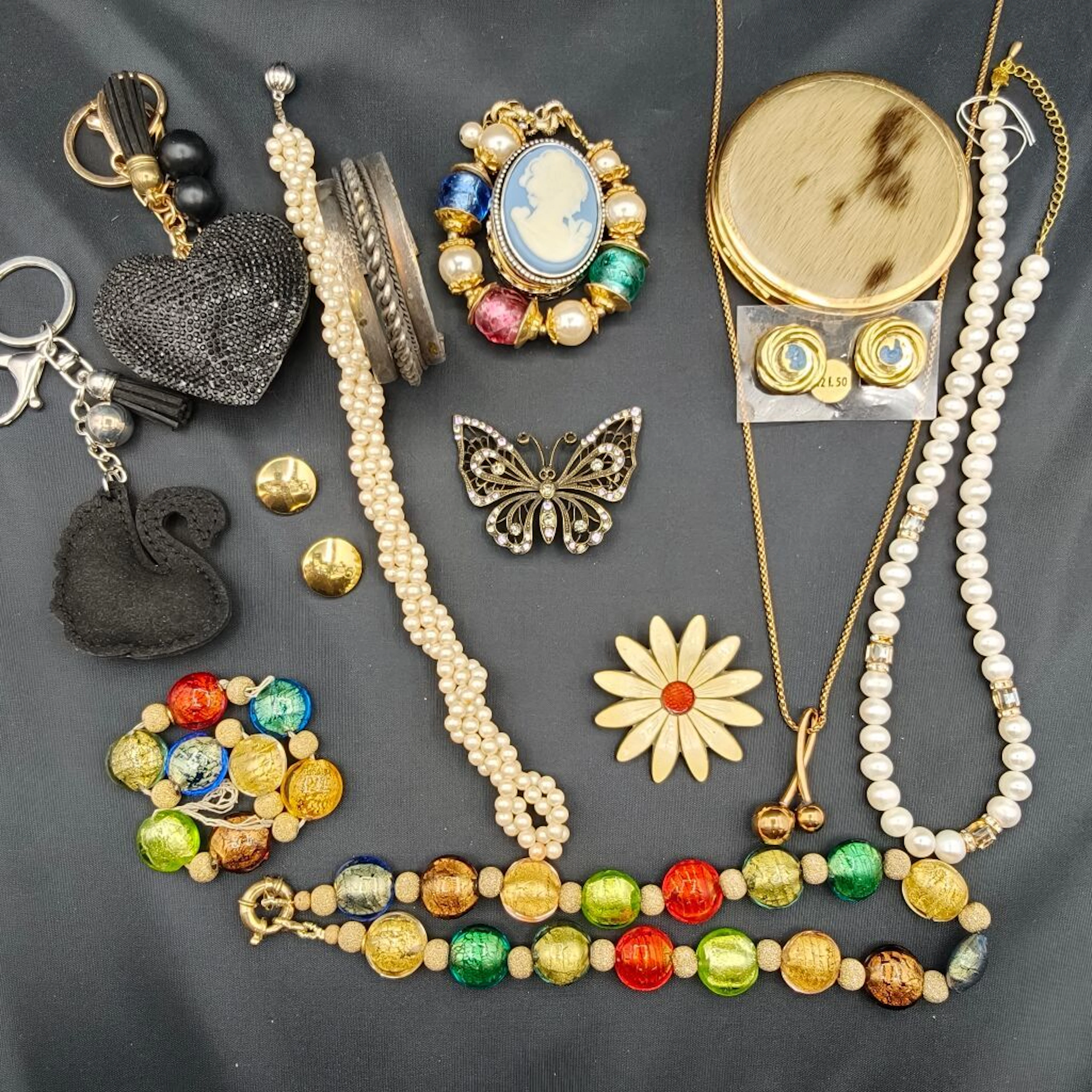 A collection of whimsical and fanciful costume jewelry featuring a