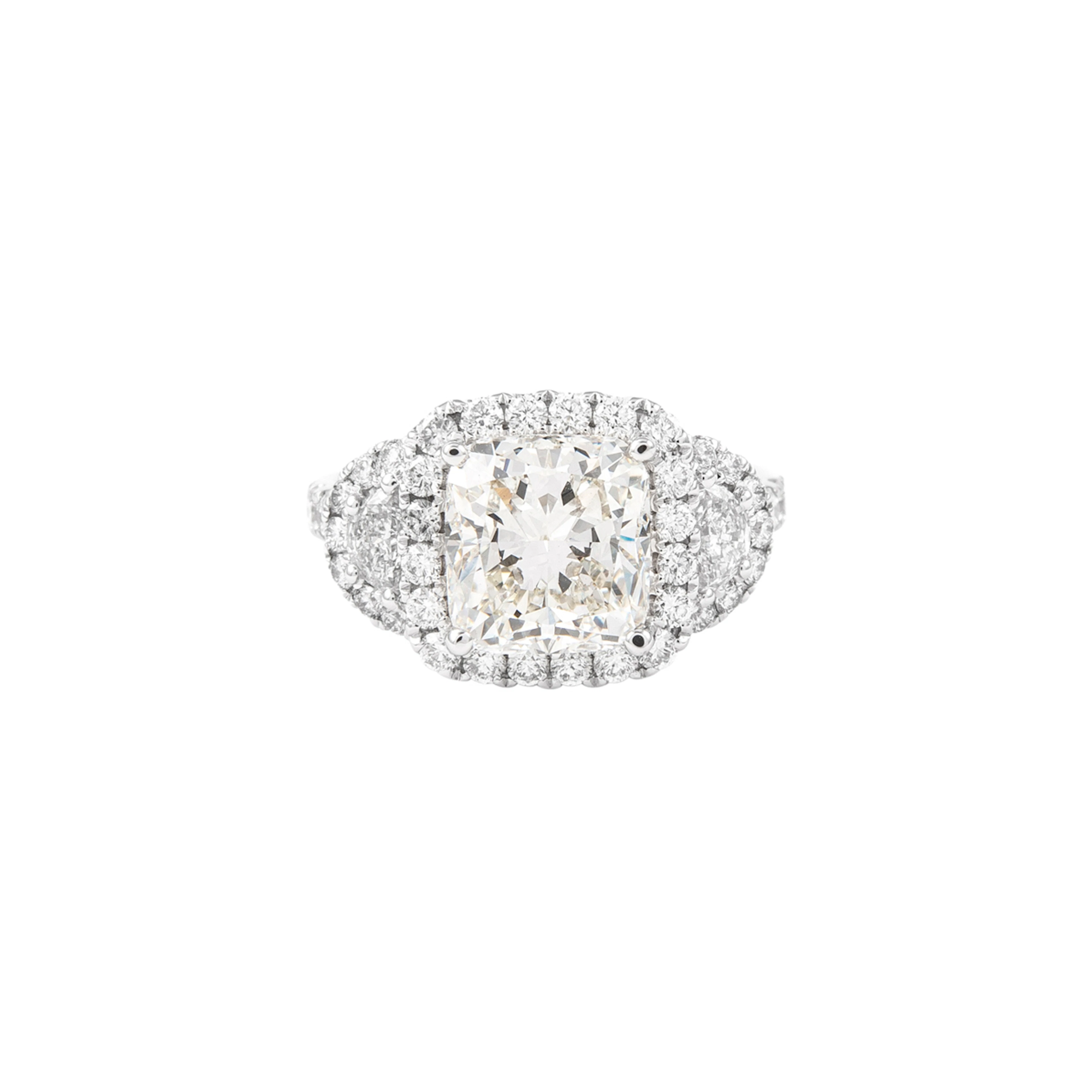 White Gold, 3.05ct Cushion Cut Diamond and Diamond Three Stone Ring