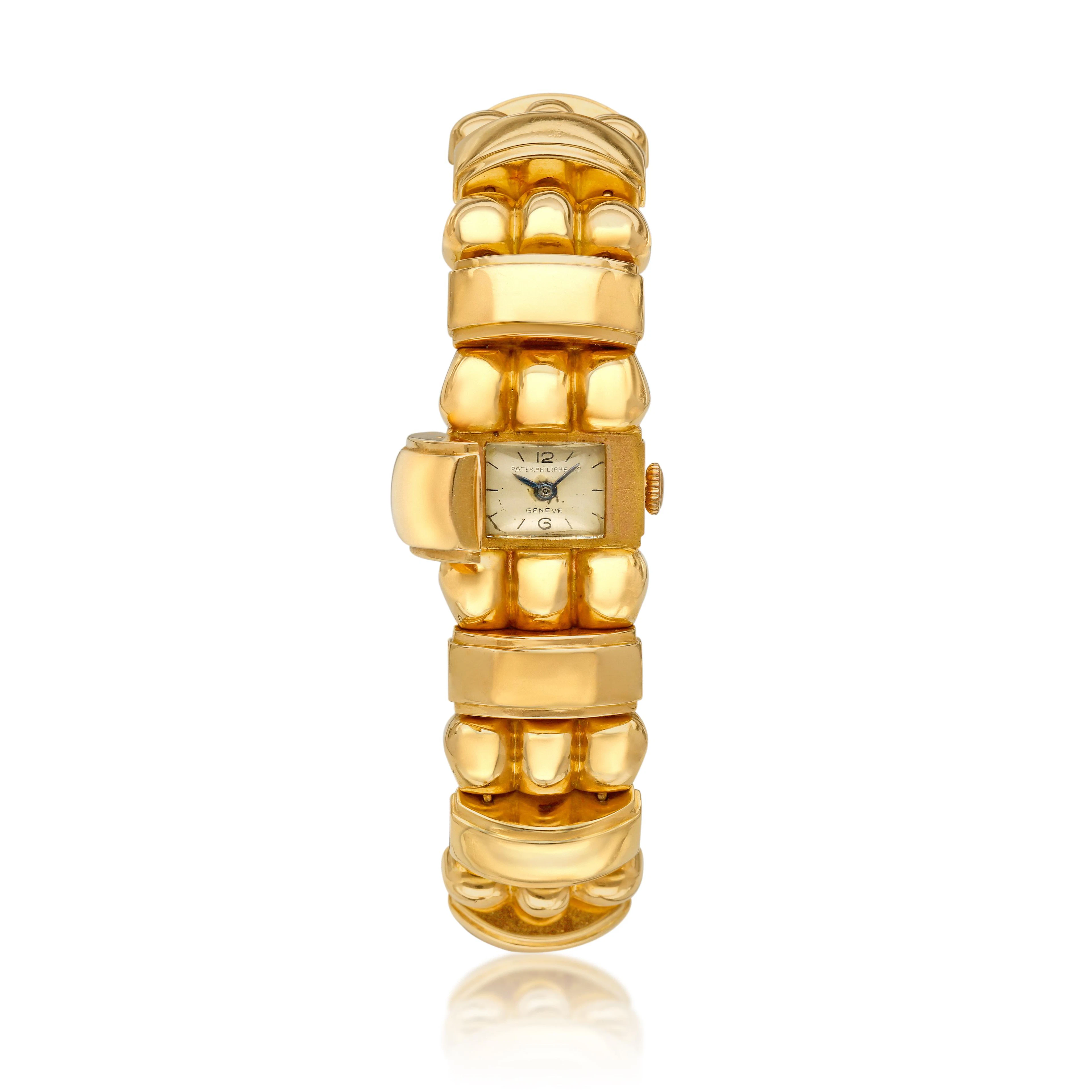 Patek Philippe & Co. A rose gold manual wind bracelet with concealed