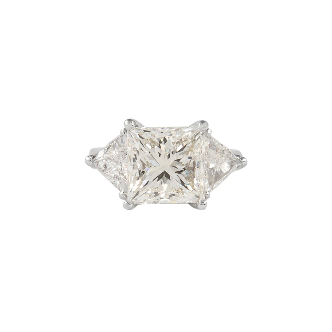 Platinum, 6.05ct Princess Cut Diamond and Diamond Three Stone Ring