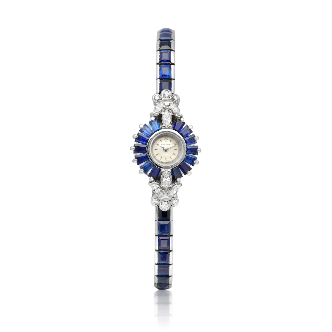 Omega. A white gold, diamond and sapphire-set manual wind bracelet