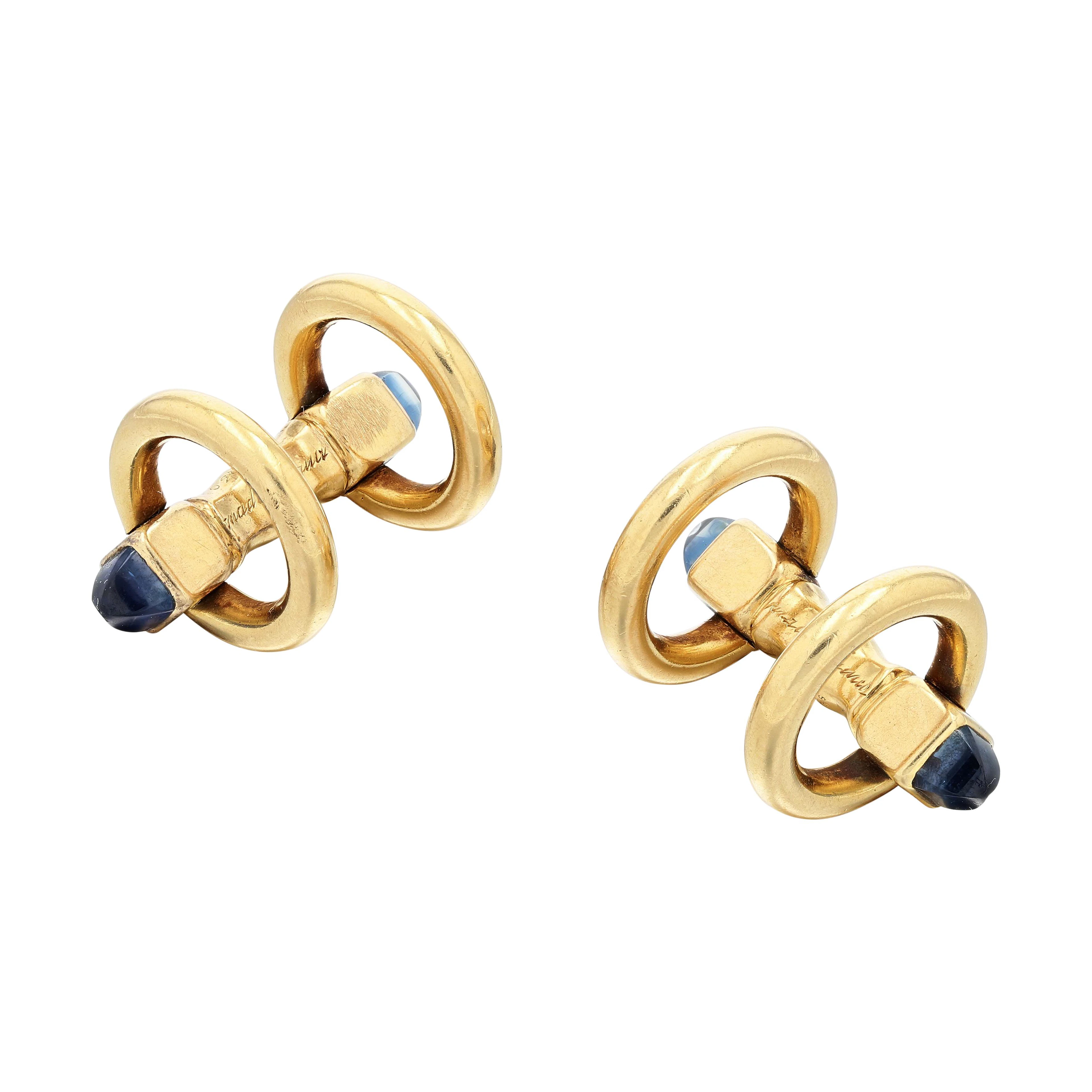 Paire de boutons de manchette or et saphirs, "Etrier" | Gold and sapphire
