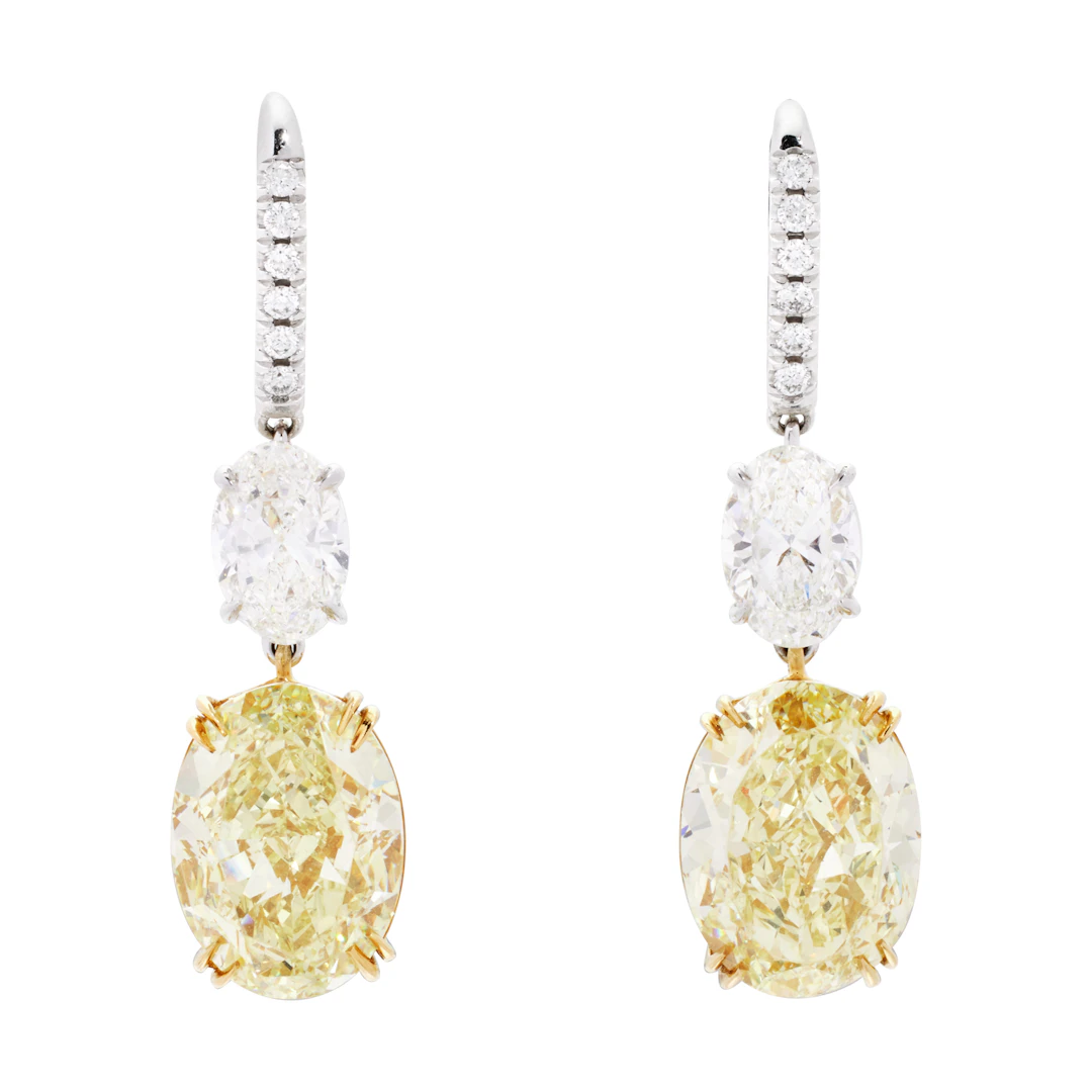 Platinum, Gold, 16.83ctw Oval Cut Fancy Yellow Diamond and Diamond