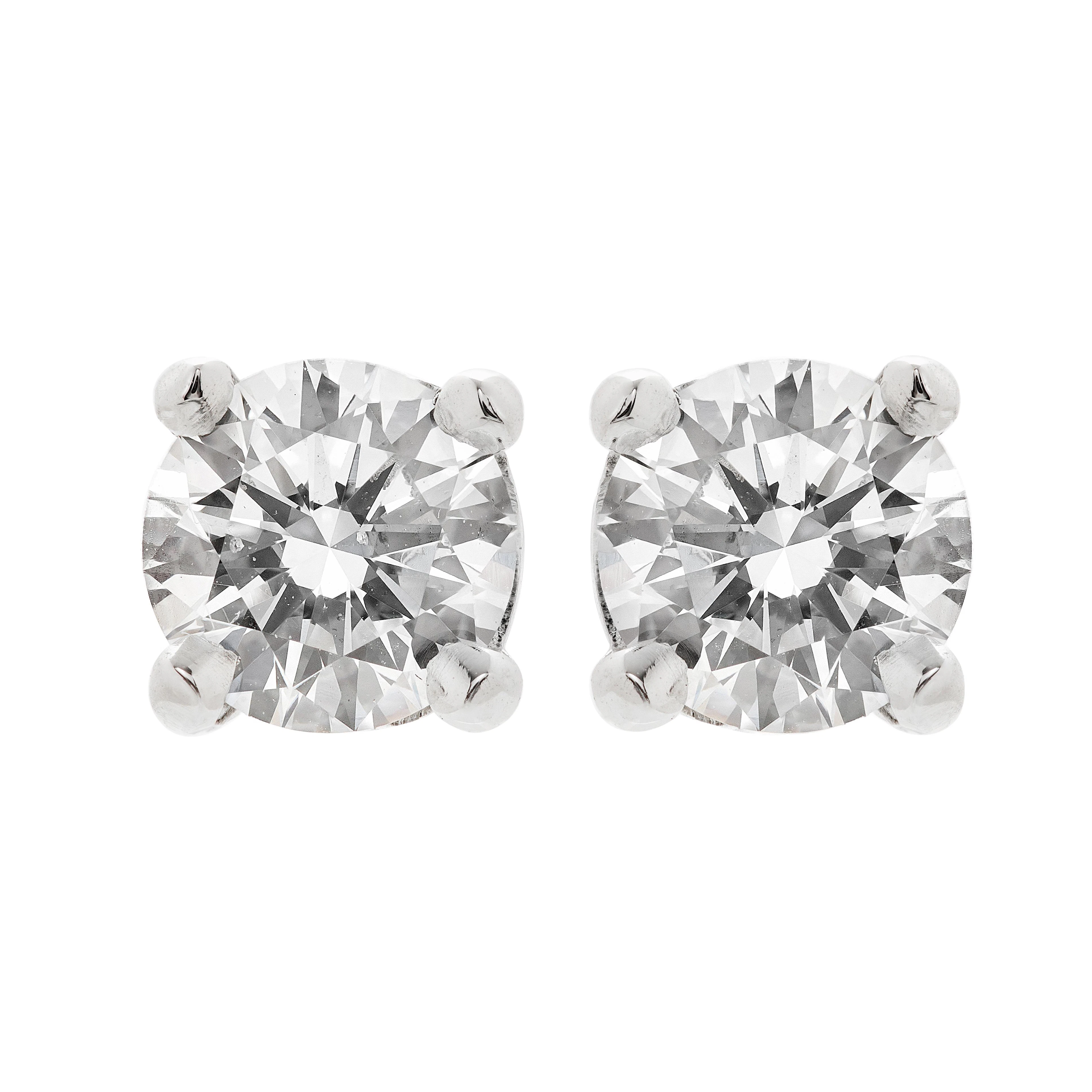 Platinum and 1.04ctw Round Brilliant Cut Diamond Stud Earrings
