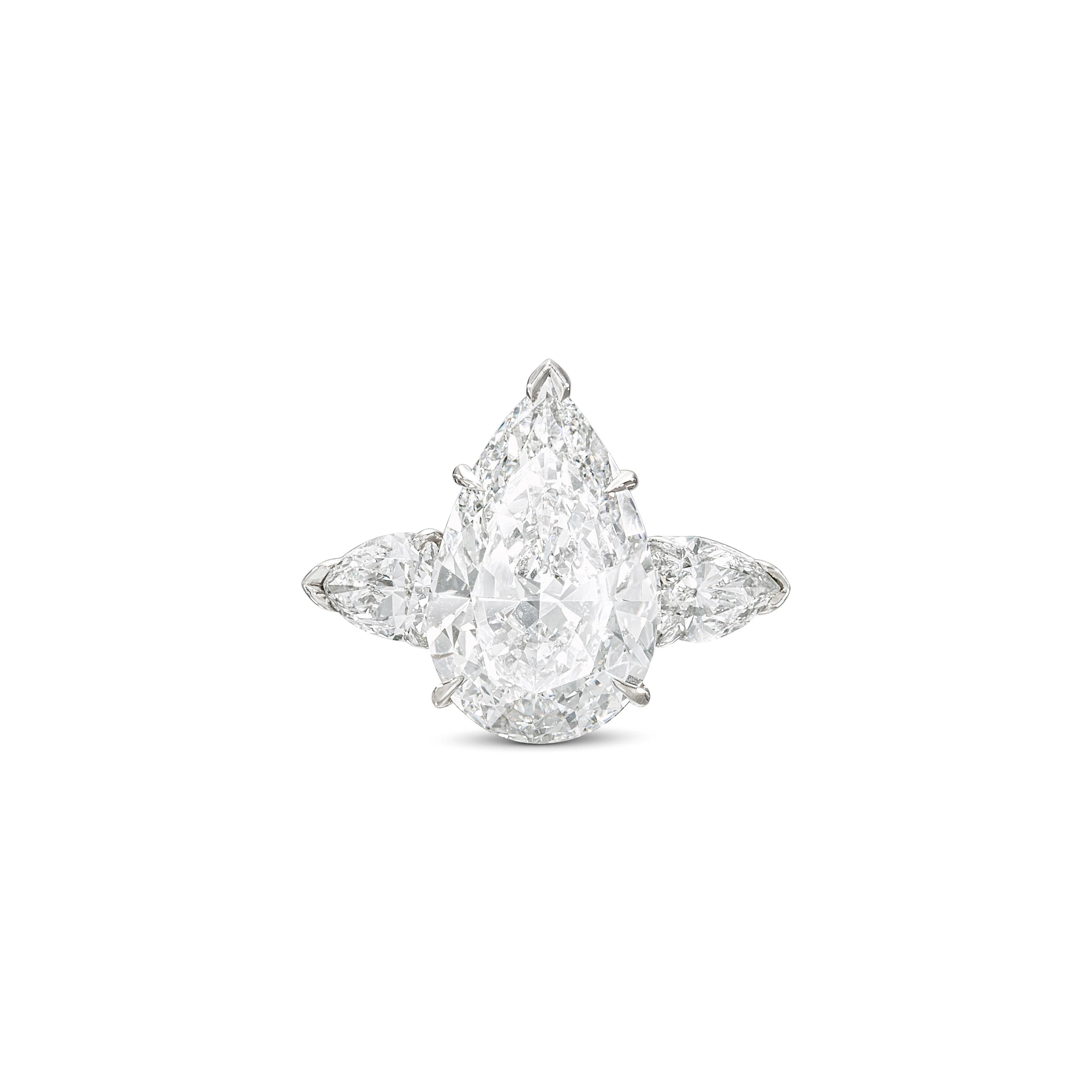 Platinum, 7.05ct Pear Shape Diamond and Diamond Engagement Ring